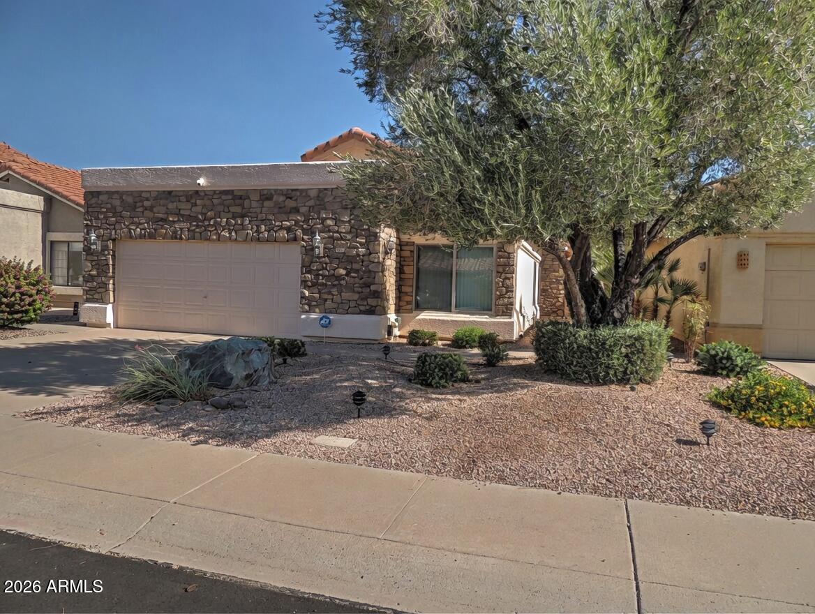 Discover this charming single-level home in the highly desirable Mountain Park Ranch community. Enjoy upgraded windows throughout for energy efficiency, abundant natural light, and year-round comfort. Attractive stone accents enhance the exterior, creating strong curb appeal and a welcoming first impression. This clean, move-in ready residence features a newer roof and A/C system, delivering peace of mind and lower maintenance. The well-manicured lot is thoughtfully maintained, while the backyard patio with spa offers the perfect setting for relaxing or entertaining outdoors under the Arizona sky. This home is located in Mountain Park Ranch, master-planned community offering breathtaking mountain views, numerous parks, tennis and pickleball courts, and sparkling community pools.
