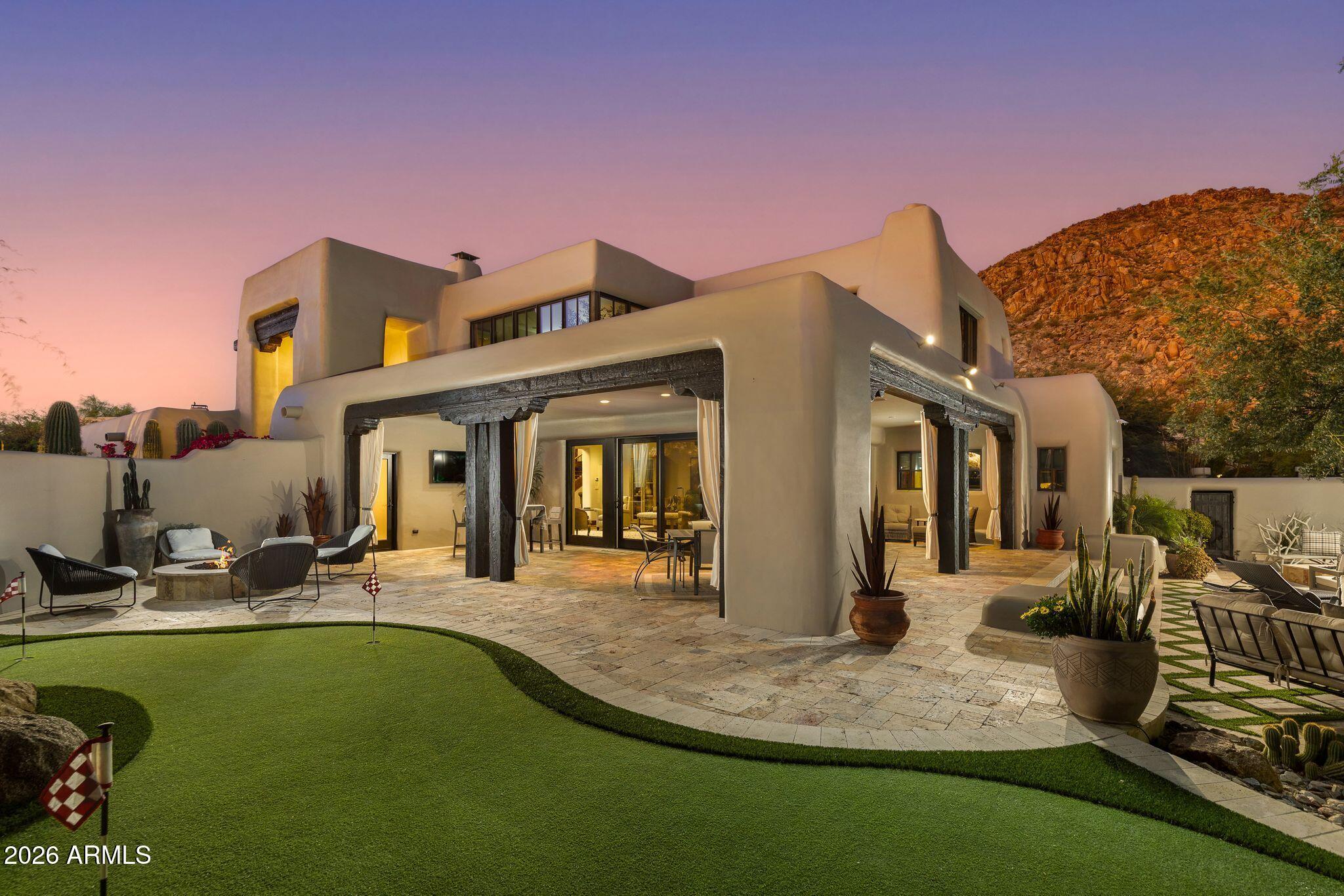 This Spanish Modern residence in the prestigious guard gated community of Desert Highlands offers a rare combination of character, craftsmanship, and enduring quality. Situated on Quiet cul-de-sac and circle driveway. Candelaria Designed home for the discerning buyer who values thoughtful construction and meticulous care, this home showcases custom cabinetry, travertine and granite surfaces, reclaimed wood beams and flooring, and artisan ironwork--materials selected for their beauty, longevity, and integrity.
Completely remodeled and impeccably maintained, the home features a luxurious primary retreat with steam shower, fireplace, and private washer/dryer. Two spacious ensuite bedrooms provide comfort and privacy, while a detached two room guest house - complete with living room, kitchen, bedroom, and full bath--offers an ideal setting for extended stays or multigenerational living.
The sunlit great room overlooks the serene backyard, and the gourmet kitchen is equipped with top tier appliances including a steam oven and wine refrigerator. A charming breakfast room opens to a cozy patio with built in Wolf BBQ and water feature. Formal dining and multiple inviting gathering spaces elevate both everyday living and elegant entertaining.
Trademark Landscape designed Outdoor living is exceptional, with expansive covered patios, a dedicated outdoor living room, heated pool and spa, and picturesque mountain views. Every space reflects pride of ownership and a commitment to quality.
Residents of Desert Highlands enjoy world class amenities, including the Jack Nicklaus Signature championship golf course, a unique 18 hole putting course, award winning clubhouse with "Jack's Backyard," a newly remodeled state of the art fitness center, the Highlands Racquet Club, and seven additional satellite courts throughout the community.
A home of this caliber appeals to the buyer who values substance over flash, craftsmanship over trend, and a lifestyle rooted in comfort, privacy, and enduring elegance.