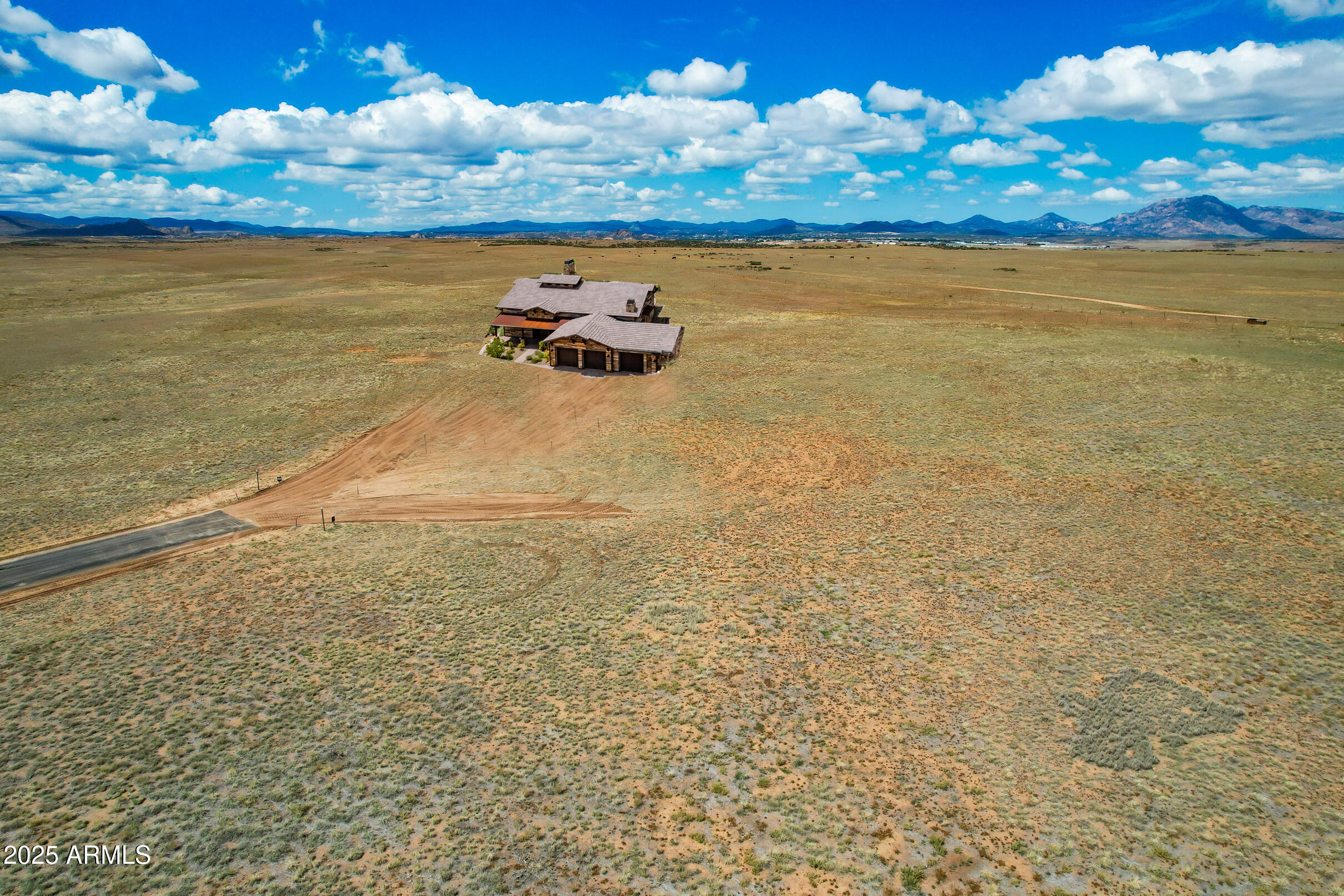 BACKING TO STATE LAND, This impressive 2,875 sq ft single-level home sits on 4 acres—offering unmatched privacy, panoramic views, and the feeling of wide-open Arizona living.
Inside, the open floor plan and split-bedroom design create both comfort and functionality. The spacious great room flows seamlessly into a gorgeous kitchen featuring a large island, custom cabinetry, stainless steel appliances, and a walk-in pantry. The adjacent dining area opens to a huge covered patio—perfect for entertaining. The primary suite boasts an oversized bedroom and a luxury bathroom with dual vanities, a walk-in full tile surround shower with glass enclosure, a soaking tub, and a spacious walk-in closet. 2 additional bedrooms, ensuitebaths, provide ideal space for family or guests. A versatile den/office offers flexibility for work or hobbies or even a 4th bedroom.
A 3-car garage with a 10' bonus bump-out provides ample space for a workshop, toys, or extra storage. The property includes a private well, alternate septic system, and a 500-gallon buried propane tank for efficient and independent living. The paver driveway and walkways, along with basic front landscaping, add beautiful curb appeal and ease of maintenance.
With state land directly behind, you'll enjoy endless natural beauty, privacy, and serenityall just minutes from Prescott Valley amenities,, including schools, medical, dining and shopping.