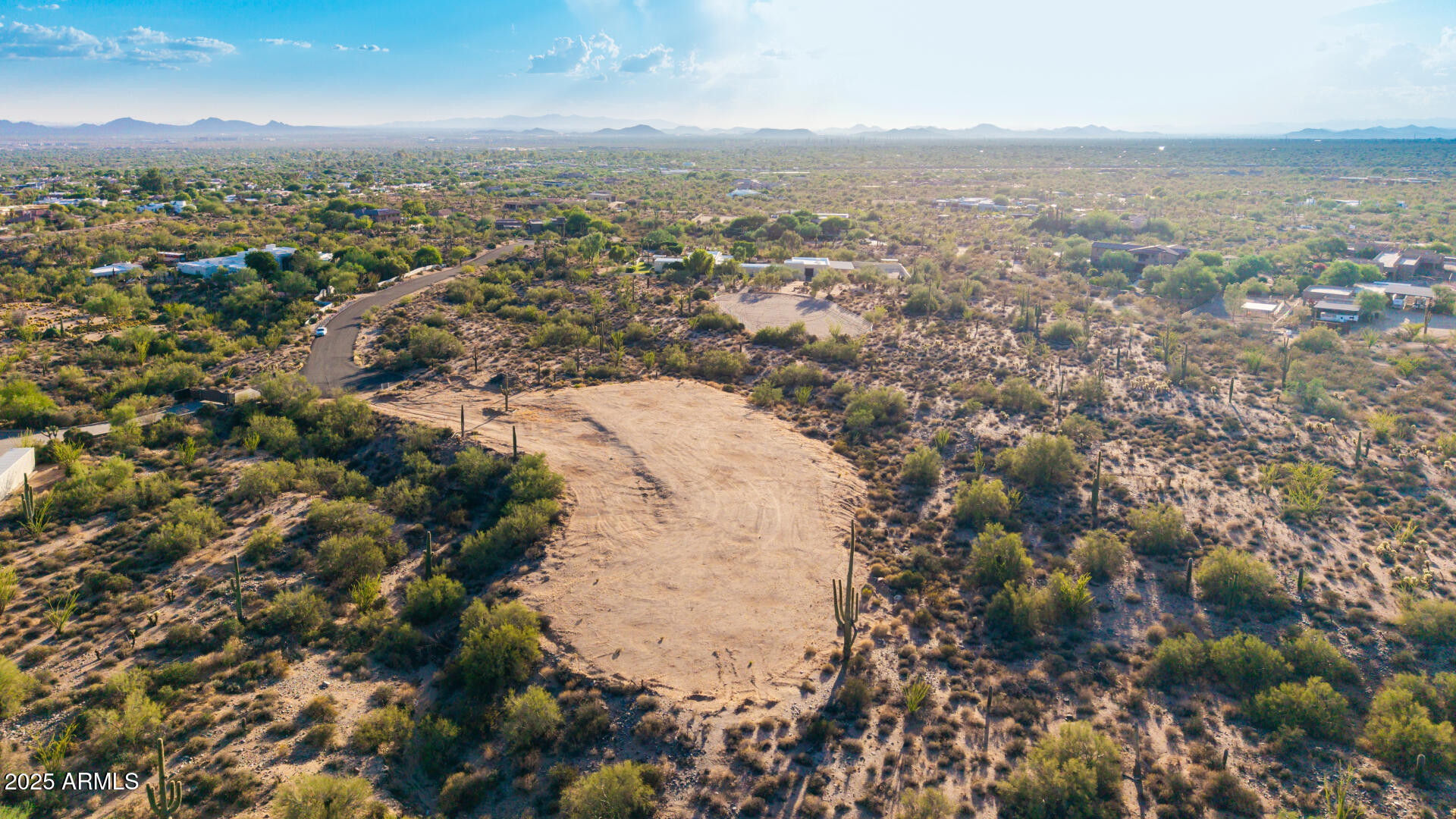 Exceptional elevated homesite in exclusive Pinnacle Peak Heights. Nearly 5 acres at the end of a quiet cul-de-sac, offering sweeping views of the McDowell Mountains, iconic Pinnacle Peak, and shimmering city lights. Graded and ready to build, with a generous building envelope ideal for a custom luxury residence or premier equestrian estate. Surrounded by natural desert beauty and privacy, yet just minutes from world-class dining, shopping, and golf. Design plans for a high-end custom home available. A rare opportunity to create a legacy property in one of North Scottsdale's most prestigious enclaves.