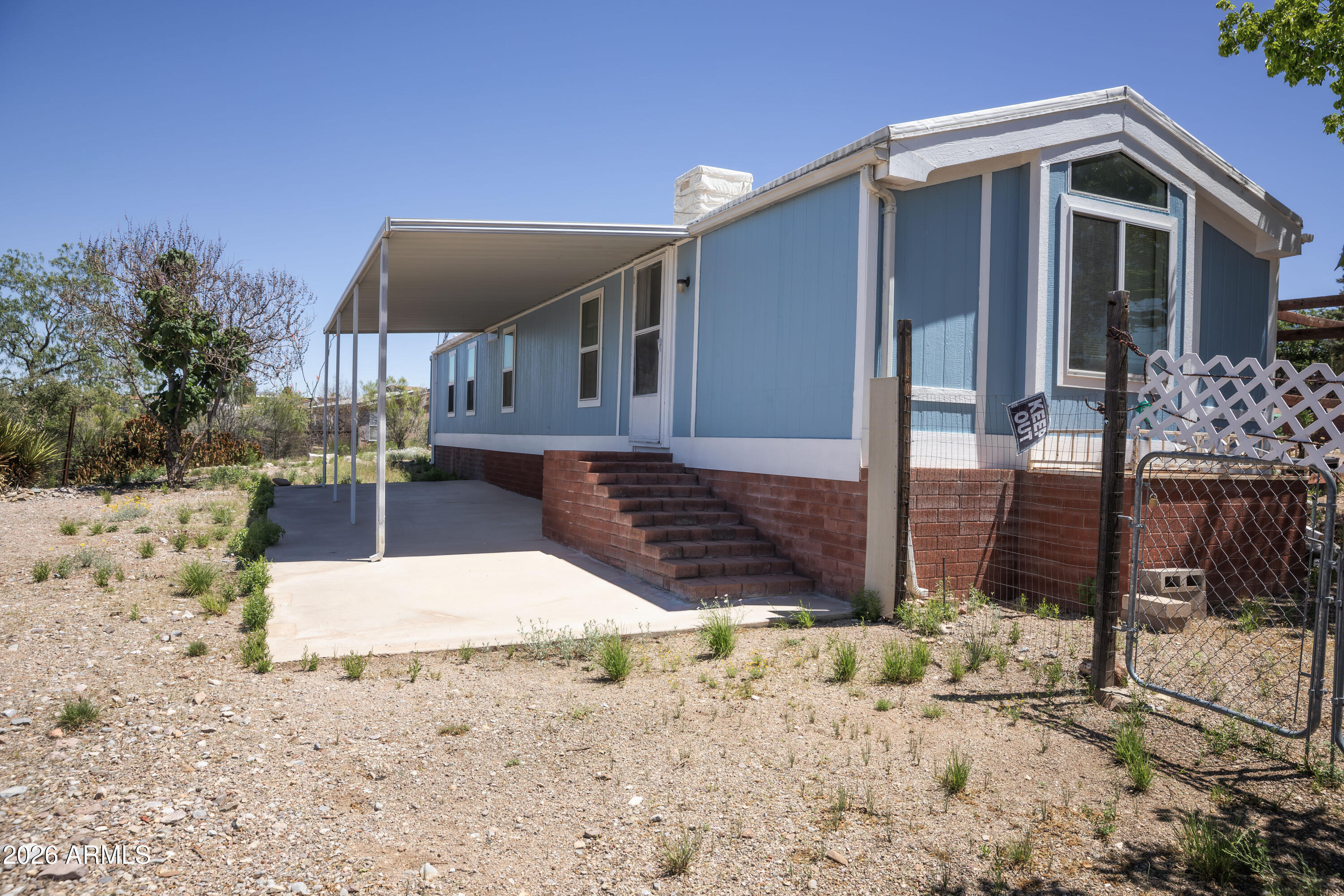 Nestled on a desirable corner lot in historic Tombstone, this cozy property offers stunning mountain views and a peaceful settling. Enjoy relaxing mornings and serene evenings under the covered back patio, perfect for taking in the natural beauty of the surrounding landscape. With its inviting charm and prime location, this home is a wonderful opportunity to experience the unique lifestyle Tombstone has to offer!