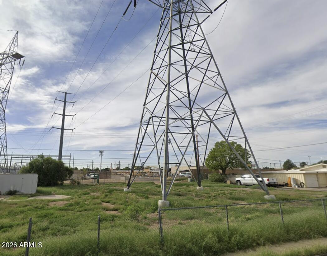 Electrical tower is on lot, causing limited use.