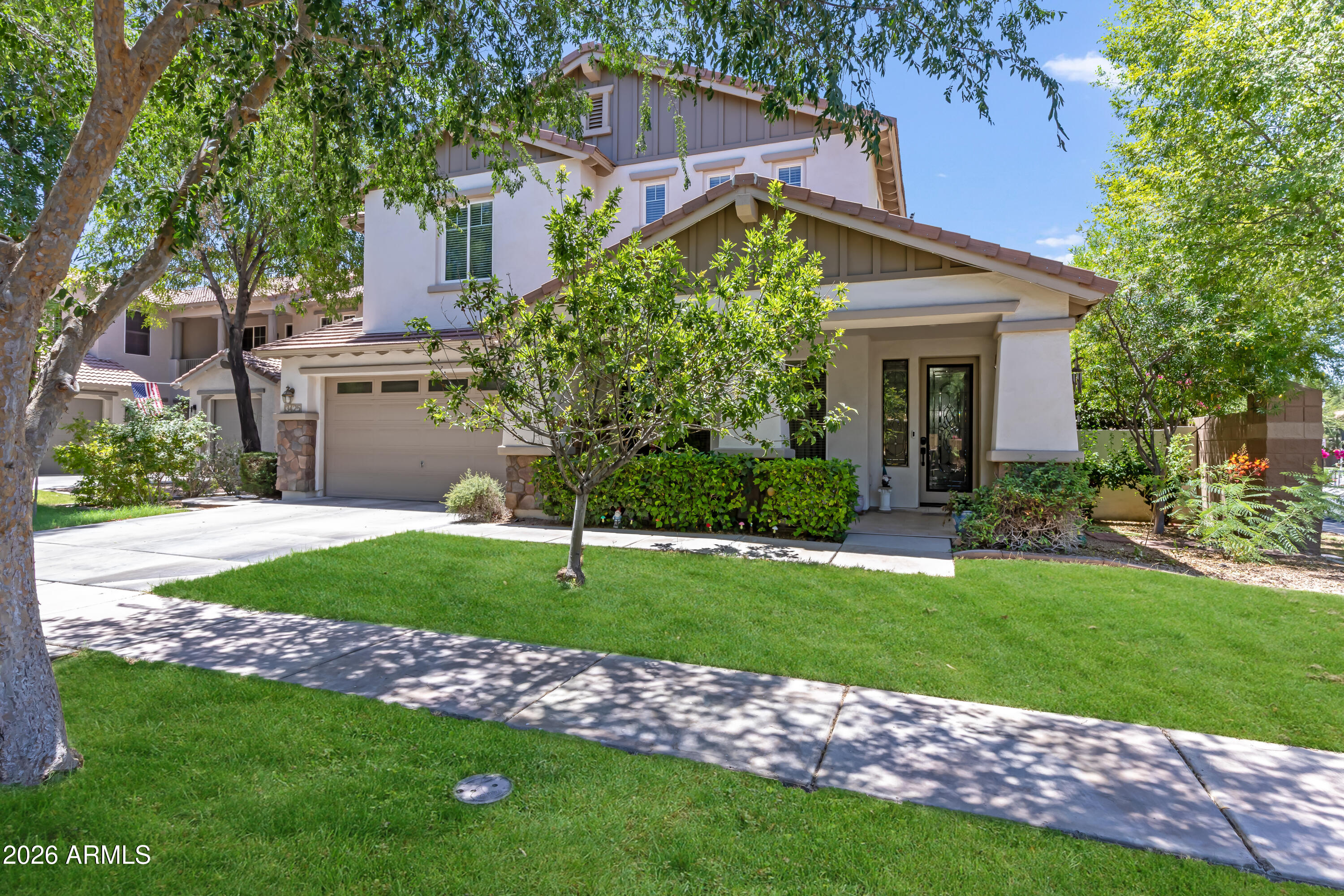 Welcome to Morrison Ranch, known for its tree-lined streets, white rail fences, parks, trails & classic modern farmhouse feel.  This spacious 5-bedroom 3-bath home has over 3500 sq ft combining function, comfort and resort-style outdoor living. Beautiful kitchen offers a large island, upgraded counters & cabinetry, gas range, double oven, stainless undermount sink & huge pantry. The open family room creates an ideal gathering space, while the primary suite features a sitting/office area, dual walk-in closets, double sinks & separate tub/shower. The private backyard is built for entertaining with a sparkling pool w waterfall, Baja step & table, built-in BBQ, above-ground spa & enclosed Arizona room.  Full bedroom & bath downstairs for flexible (multi generation?) living and 3 car garage.