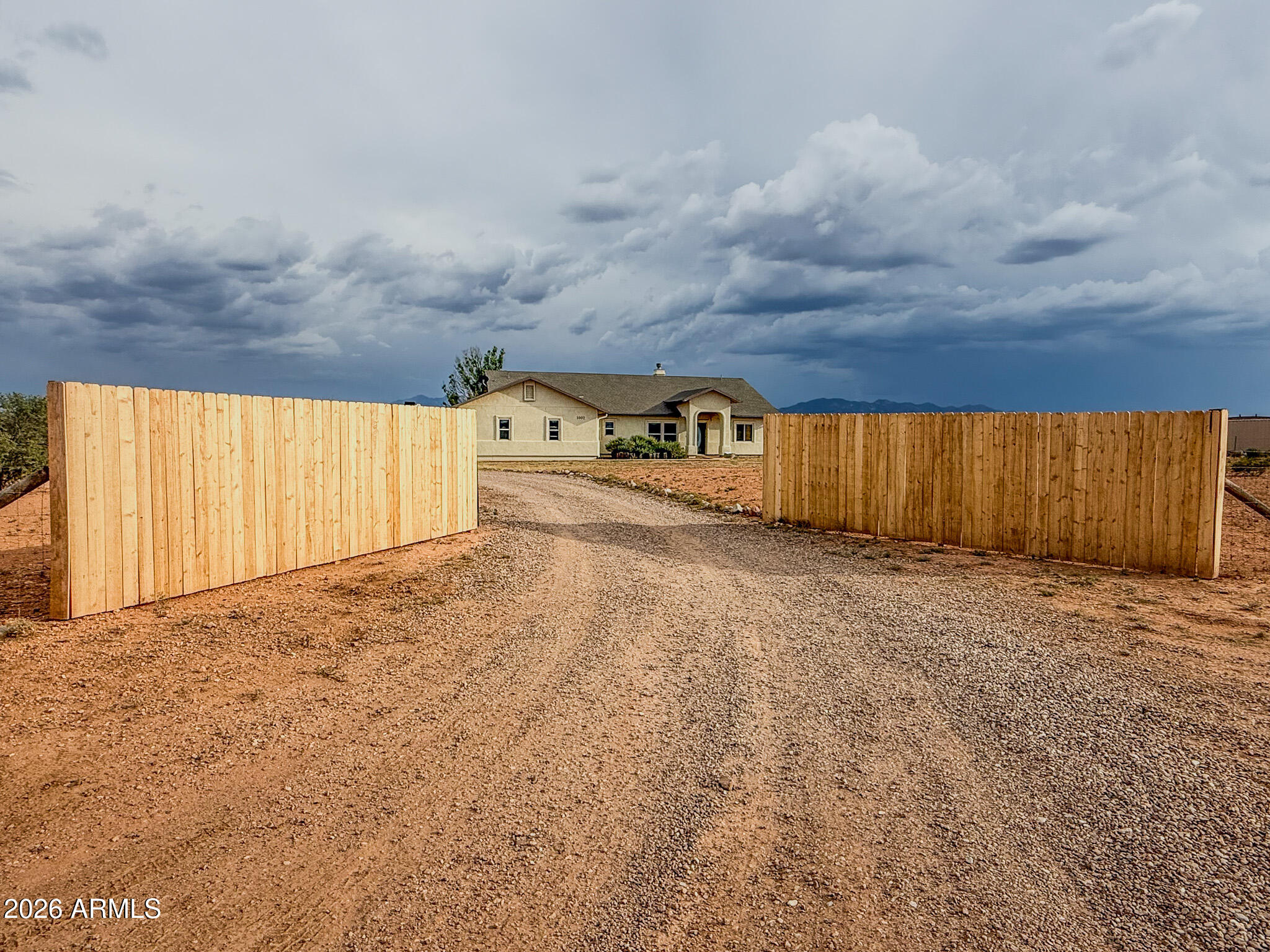 Discover peaceful country living on 3.9 acres in Whetstone! This charming 3-bed, 2-bath site-built home offers stunning desert and mountain views with easy access to Sierra Vista, Fort Huachuca, and Tucson. Inside, enjoy tile flooring in the kitchen and dining areas, and cozy carpet in the living and bedrooms. The home features an open-concept layout filled with natural light, and a kitchen equipped with stainless steel appliances and ample counter space. Solar panels provide energy efficiency and reduced utility costs. A split-bedroom design provides comfort and privacy, while the spacious yard includes a covered patio and space for animals, gardening, or future additions. Bring your toys, RV, or horses--there's space for it all!