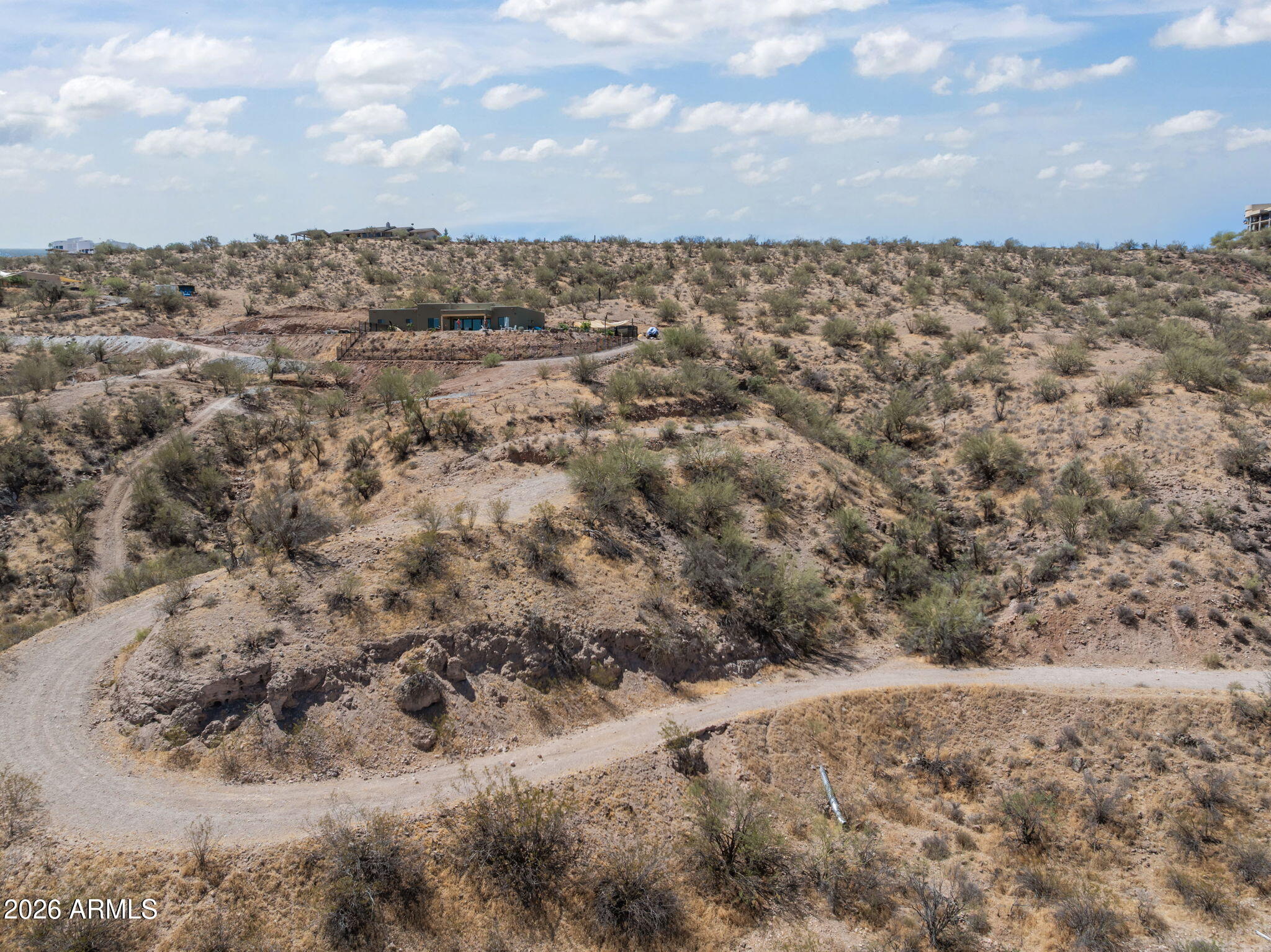 Turtleback Mountain Ranch 5 AC parcel.  Shared well located on the property.  Beautiful acreage located mid-town for easy access yet private  surrounded by peaceful desert landscape.  Rough road graded in to the possible pad site.  This would piece would make for a great walk-out basement home.  Get creative and come take a look at this well priced 5 ac piece with water!