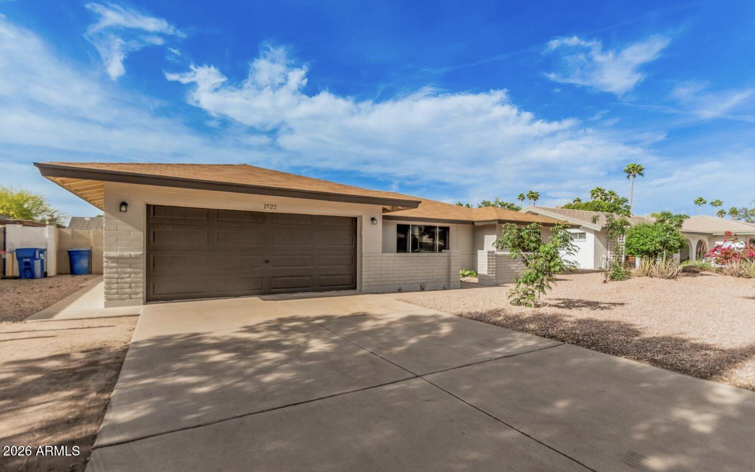 Welcome to this spacious 5-bedroom, 2-bathroom home offering 2,085 sq. ft. of comfortable living space in a highly convenient Tempe location near ASU, shopping, dining, and major freeways. The home features a functional floor plan with plenty of room for bedrooms, home office space, or additional living needs. Inside, you'll find low-maintenance tile and vinyl flooring throughout, giving the home a clean and practical feel. The property also includes iron security doors on the entrances and exits for added peace of mind. The kitchen and living areas offer a comfortable setup for everyday living, while the generous bedroom count provides great flexibility. Step outside to a beautifully finished backyard featuring pavers, turf, and a covered patio--perfect for relaxing, entertaining, or enjoying Arizona evenings with minimal maintenance. The home has also been well cared for, with fresh exterior paint and thoughtful updates completed over the years. Located less than a mile from the US-60 and Loop 101, this home offers quick access to ASU, downtown Tempe, Mesa, Chandler, Scottsdale, and the surrounding East Valley. No HOA adds even more convenience and flexibility.