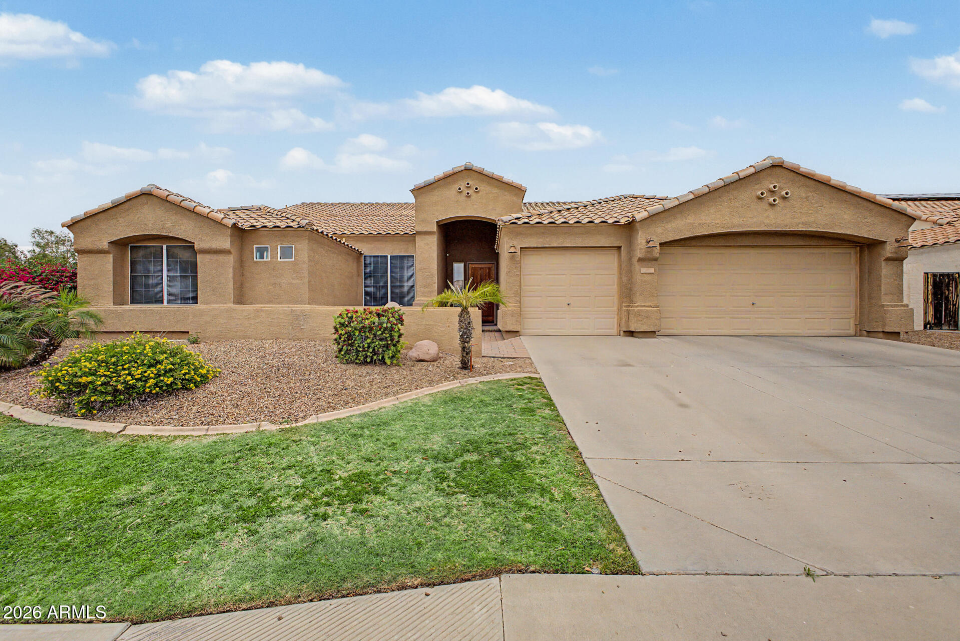 Beautiful 3 bedroom 2 bathroom single-story nestled on a corner lot offering a 3 car garage with an extended driveway and a Pool! A paver courtyard leads to the front door entry.  Inside offers sizable living spaces showcasing two-tone paint, tile flooring, plush carpeting and decorative hardware and fixtures. The kitchen has plenty of counter space, wood cabinetry, stainless steel appliances, track lighting and an island with a breakfast bar. The main retreat is complete with a walk-in closet, a full bathroom with an oversized dual-sink vanity and a separate shower/ tub and a private exit. A spacious den opens to the family room for added convenience! Enjoy outdoor living in the backyard, complete with a covered patio and an outdoor fireplace, a built-in BBQ and a refreshing pool. Close to dining, shopping and entertainment. Come and see!