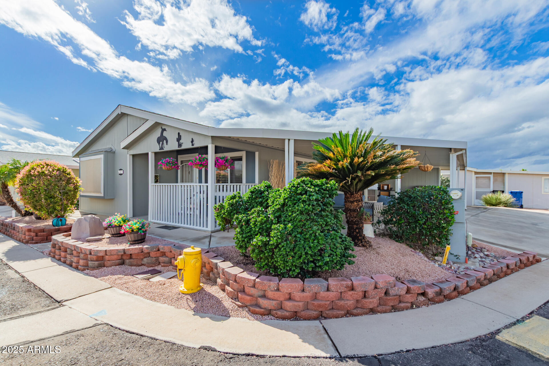 SUMMER SPECIAL ''3 MONTHS FREE RENT''  Beautifully maintained home in 55+ gated community tucked away in a quiet peaceful setting with a LOW lot lease, only $700 per month! This charming home sits on a spacious corner lot with beautiful landscaping and an easy-care drip irrigation system.  Enjoy peace of mind with major updates already completed, including HVAC, stainless steel refrigerator, dishwasher, gas water heater, interior paint (2023), and a roof inspected last year with an estimated 10+ years of remaining life. The home also features premium oversized Electrolux washer and dryer units with built-in pedestal storage and convenient pull-down laundry hampers.  Relax on the inviting covered porch with your favorite morning coffee or evening beverage while enjoying the serene surroundings. Additional highlights include a large carport, oversized storage shed, and pride of ownership throughout. Residents enjoy resort-style community amenities including a heated pool and spa, fitness center, clubhouse, shuffleboard courts, putting green, and fun organized monthly social events.  Lot lease was just REDUCED to only $700/month and includes sewer, and trash services. Buyer must complete community application and receive park approval prior to ownership. Applicants must have a minimum 700 FICO score, verifiable income of at least 3x the monthly lot lease, and pass a background check. Application available in the documents tab.