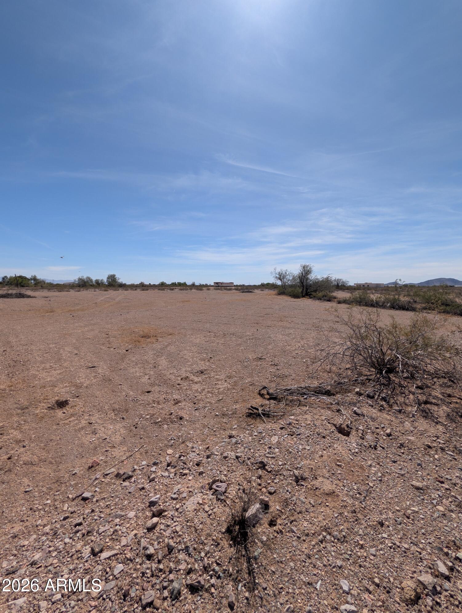 Own your piece of the desert with this stunning 1-acre lot featuring breathtaking, panoramic mountain views! Accessible by a mostly level dirt road that any standard car can easily navigate, this property offers the perfect blend of remote peace and easy access. A small wash gently cuts across one corner of the lot, creating a natural corridor that brings local wildlife right to you for fantastic viewing. Best of all, we are making ownership easy and accessible with flexible seller financing available.