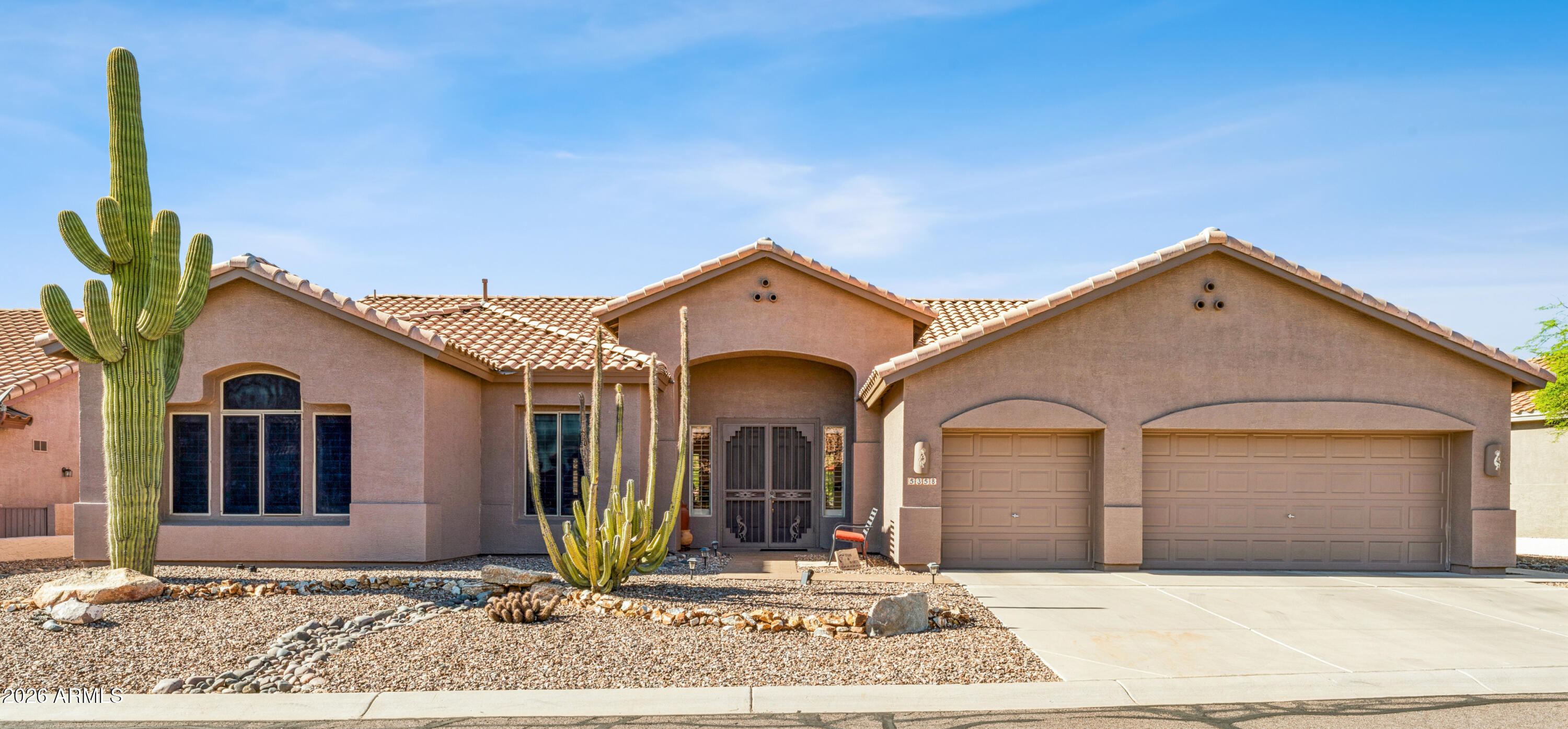 Bright, open-concept designed Cottonwood model highlighted by walls of windows that flood the living room, kitchen, and master suite with natural light. Mostly furnished home features: Kitchen w/granite countertops, pull-out shelves, and stainless steel appliances; 2 bedrooms, 2.5 baths; plus a flexible bonus/hobby/office room; Master Bedroom w/bay-window sitting area; Plantation shutters throughout; 3-car garage w/built-in cabinetry & durable Epoxy flooring. Recent Updates:2025: Exterior paint, Epoxy garage floor, A/C, and Furnace.   2024: Reverse osmosis system, Water heater, & Roof underlayment.  Enjoy entertaining your guests on your private, professionally designed and landscaped rear patio. Experience the best of active adult living with top-notch community amenities, and  (see More) public golf, and on-site dining, all nestled at the base of the majestic Superstition Mountains.

2021: New Refrigerator, dishwasher, and microwave. Backyard professionally remodeled by Smiling Dog Landscaping.