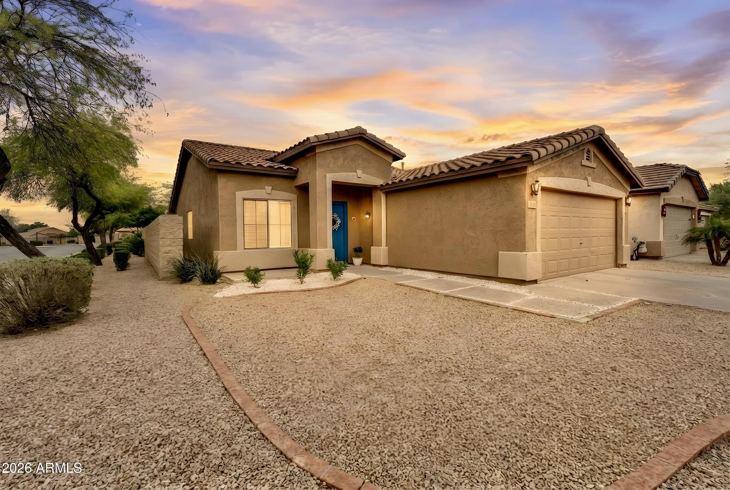 Nestled on a premium corner lot in the sought-after Johnson Ranch-Stonegate community, this charming 3-bedroom, 2-bath home offers comfort, style, and endless potential. A low-maintenance landscape, inviting curb appeal, and a 2-car garage set the tone for what awaits inside.

Step into a bright and welcoming interior featuring trending paint tones, neutral tile flooring, plush carpet in all the right places, and a spacious living and dining area perfect for both everyday living and entertaining. The eat-in kitchen is thoughtfully designed with warm wood cabinetry, built-in appliances, track lighting, and a convenient pantry.