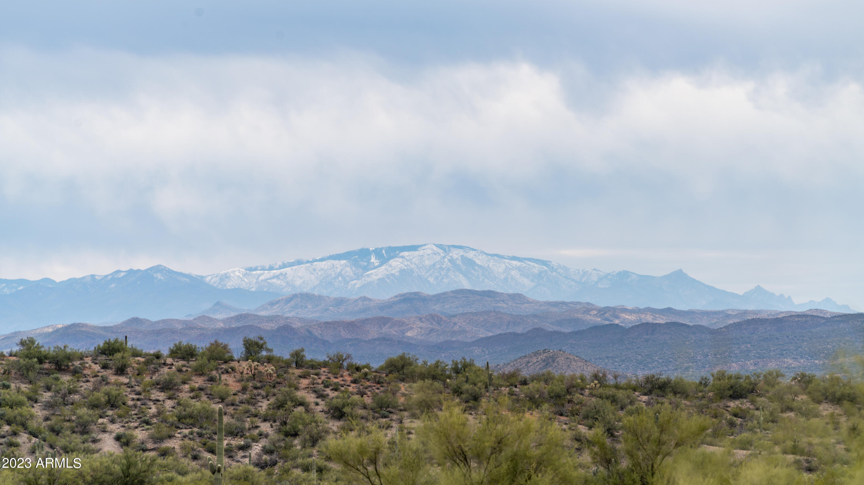 Looking for a secluded off-grid retreat with incredible privacy and natural beauty? This unique property borders the San Carlos Apache Tribal lands & is surrounded by rolling hills, mature desert vegetation, and abundant wildlife, creating the perfect escape from the stresses of everyday life. Ideal as a recreational getaway, future homestead, or self-sufficient ''bug-out'' property, you'll enjoy peace & solitude while still being less than 20 minutes from supplies & conveniences. Be sure to watch the drone video to fully appreciate the lot, breathtaking views, & surrounding landscape. Multiple trails wind throughout the area, offering endless opportunities for hiking, exploring, hunting, outdoor adventure. Create your own private desert oasis and experience the freedom of wide-open spaces