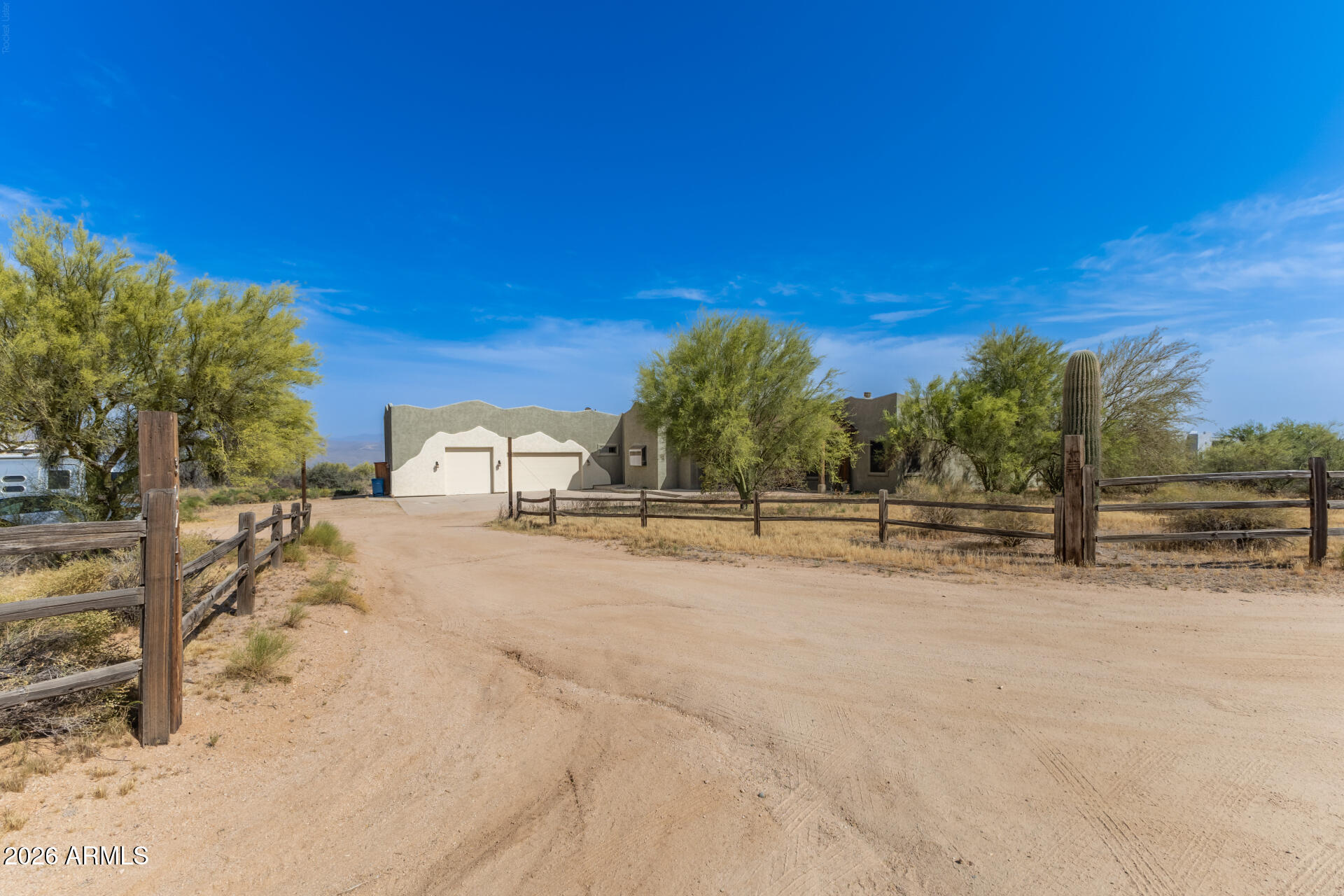 Fantastic opportunity to own this 4-bedroom home on a sprawling 2.5-acre horse property! You're welcomed by a 3-car garage, natural desert landscape, and an inviting front patio. Fall in love with the captivating living room with high ceilings, a soothing palette, recessed lighting, All new Saltillo tile flooring, interior paint, and a stone-clad fireplace. The stunning eat-in kitchen comes with granite counters, ample wood cabinetry, a stone-tile backsplash, stainless steel appliances, a pantry, and an island with a breakfast bar. The primary bedroom showcases sliding door access to the backyard for seamless indoor-outdoor flow, a private bathroom with dual sinks, and a walk-in closet. Unwind on the charming rooftop deck, offering panoramic views of the desert and distant mountains. The expansive outdoor space provides a sizeable covered patio, stylish pavers, and abundant space for crafting your dream outdoor oasis or establishing equestrian facilities. Don't miss out on this incredible gem!