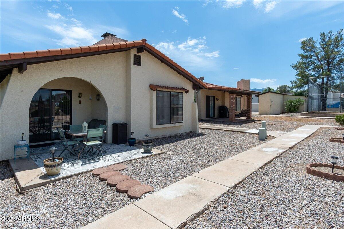 Stand alone townhouse with NO SHARED WALLS with neighbors! 2 bed, 2 bath updated unit with stainless steel appliances in kitchen and covered patio. Large master suite with extended closet. COVERED parking for 2 vehicles with an outdoor storage room. Carpet only in bedrooms.