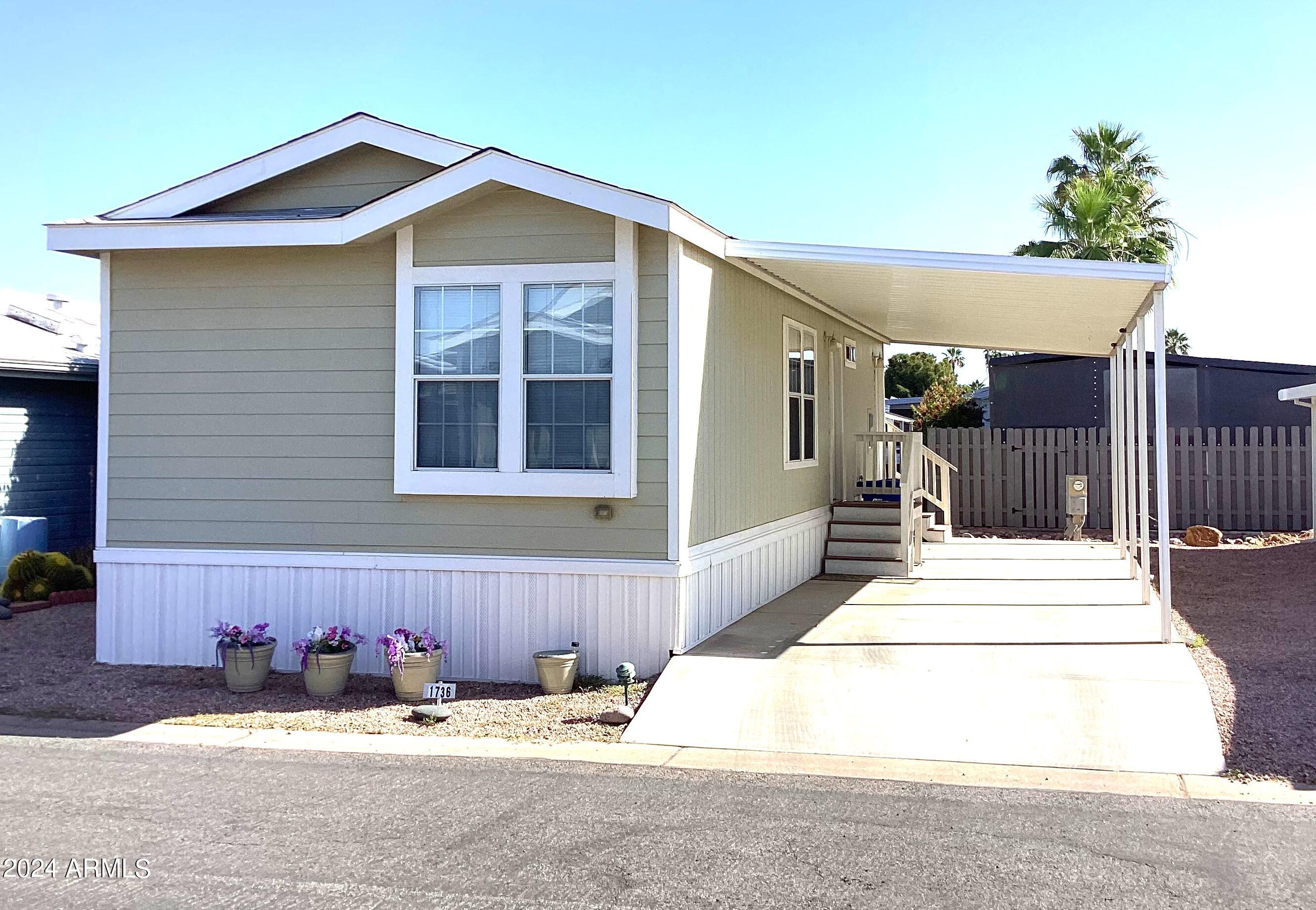 This home is in a premiere age-qualified resort with a plethora of amenities including 3 beautiful swimming pools, 8 lighted tennis courts, a softball field, a putting green, and so, so much more. You're not just buying a home; you're buying a lifestyle! With this recently updated 2015 home you'll have 2 bedrooms, 2 baths in a split floor plan, modern white appliances, vinyl plank flooring throughout and a stacked washer and dryer. Great shopping and dining within 2-3 miles, easy access to Loop 202 or I-60, and 30 mins to Sky Harbor Airport Canyon Lake, or the Renaissance Festival. Seller is owner/agent and may carry, reach out for details.