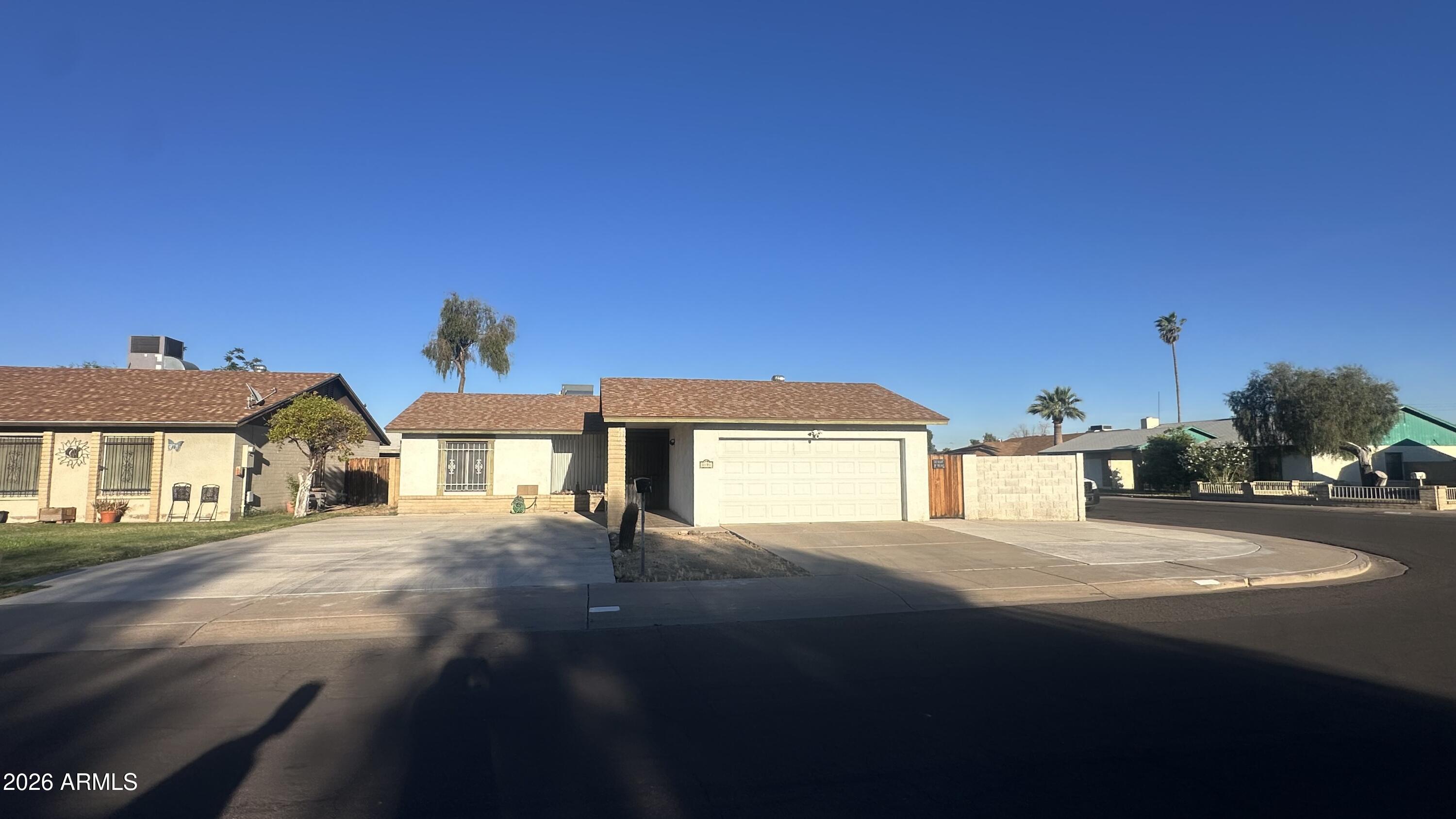 NO HOA!  Home on Corner Lot with RV Gates & Extended Parking.
Move-in ready 2-bedroom, 1-bath block home on a large corner lot with RV gate and no HOA!  2-car garage plus an extended concrete slab with space for up to 6 additional vehicles--perfect for RVs, food trucks, or work trailers. Double-door entry opens to a large great room with vaulted ceilings. Tile floors throughout and ceiling fans in both bedrooms and the family room.  Spacious kitchen includes ample cabinet space and a good-sized dining area. Both bedrooms are generously sized, and the bathroom offers plenty of storage. Large backyard, with covered patio.