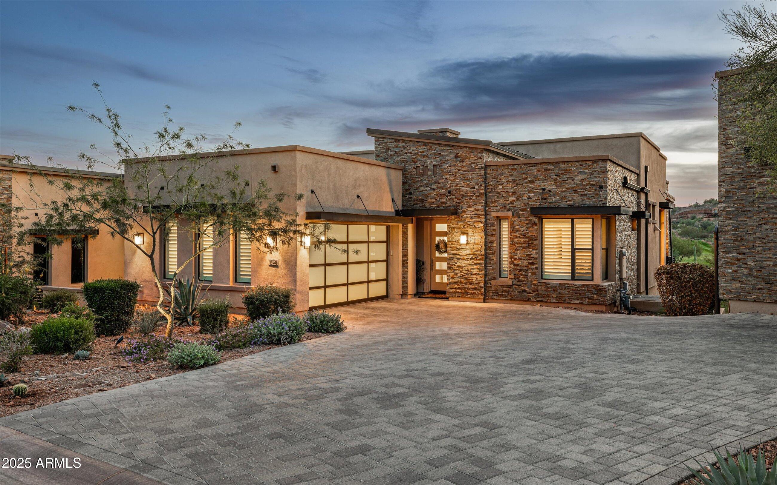 Experience luxury desert living in this exceptional 3 bed, 3.5 bath townhome located in the prestigious Overlook at Firerock community. This home's open-concept floor plan seamlessly connects indoor and outdoor living, featuring dramatic corner sliding glass doors that open to an expansive patio—perfect for entertaining or relaxing while taking in breathtaking views of the 18th hole at Firerock Country Club, surrounding mountains, and unforgettable sunsets. The main level offers a spacious primary suite with a luxurious bath and large walk-in closet, a hidden walk-in pantry, and a secondary bedroom with an en suite bath. The picturesque kitchen boasts high-end finishes, custom cabinetry, and elegant details throughout. Downstairs, the large living/game room with a wet bar and another set of sliding glass doors opens to a private spool (spa + pool) area overlooking the lush golf course. The lower level also features the third bedroom, the third bathroom, and a great "flex" room that could be used as an office or workout room, or even an additional bedroom (just without a window or closet). Additional highlights include two brand-new full HVAC systems (installed in 2025), premium materials and craftsmanship throughout, and thoughtful design that balances sophistication and comfort. This home truly has it allluxury, views, and an incredible location.