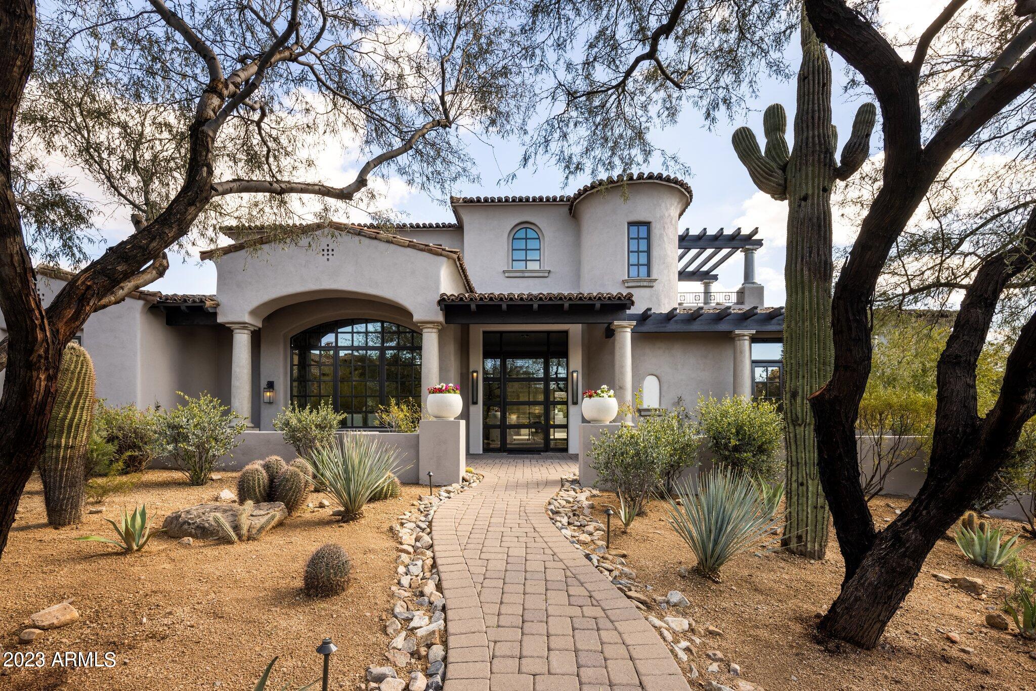 Fabulous home in the renowned guard gated community of DC Ranch Country Club.  This 4 bed, 3.5 bath home plus a guest casita, has just undergone an elegant and timeless renovation with exquisite touches. The principal suite has its own private wing with a sitting area, dual closets, dual sinks, access to the stunning back yard.  The gourmet kitchen is a chef's dream with stainless steel appliances, a double oven, a microwave and warming drawer and sophisticated finishes.  Upstairs there is a massive game room and sitting room with access to three view decks that capture the city light, sunset, and mountain views; you can also see golf in the distance.  Outdoors is everything you could hope for with plenty of space living and playing – perfect for entertaining!