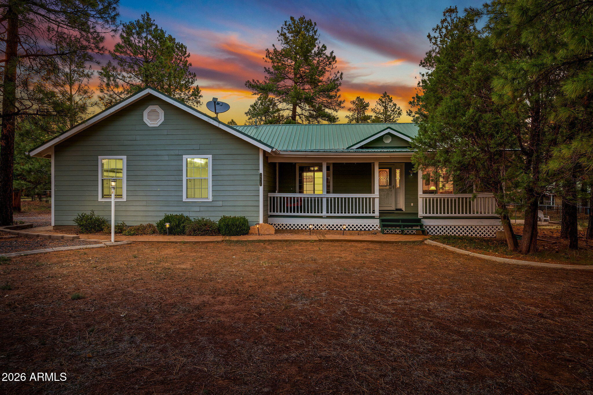 Escape to this beautifully wooded retreat located in the desirable forest trails community and majestic tall pines. This spacious 4 bed, 2 bath furnished home offers 2,366 sq ft of comfortable living with vaulted ceilings and central heating & cooling. The kitchen features abundant cabinet space, roll-out drawers, 2 pantries, new appliances, and generous counter space. The finished basement is ideal for a game room, extra bedroom, or storage. Enjoy year-round outdoor living on the covered front and rear decks. Additional highlights include an electric fireplace, metal roof, 2-car attached garage, fenced backyard with chain link, landscaped yard with drip system, and low HOA dues to protect your investment. A peaceful mountain lifestyle awaits!