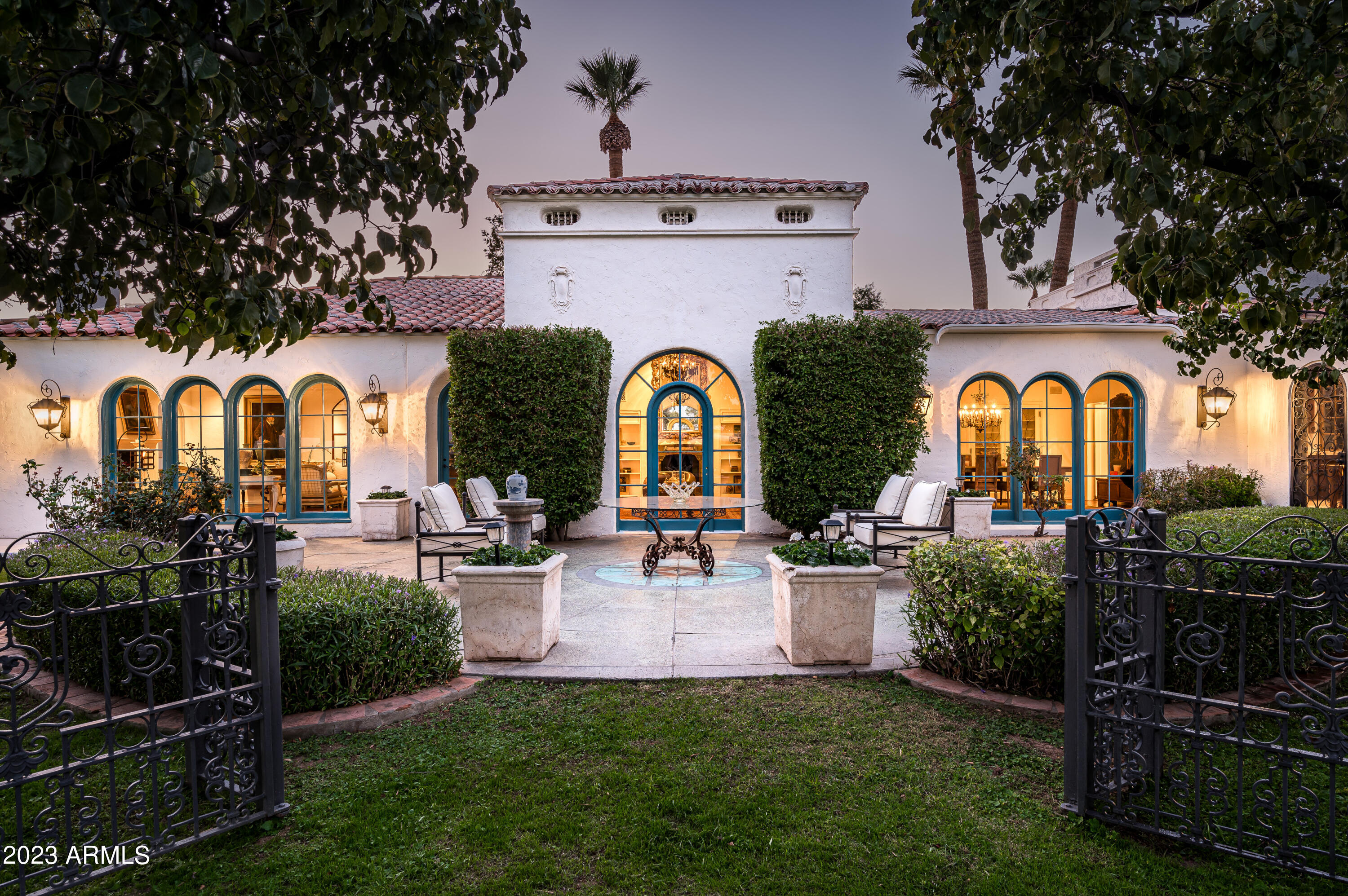 Classic elegance, architecture and design impeccably remodeled and perfectly located on the 18th fairway of the Phoenix Country Club golf course. This Spanish/Santa Barbara home was designed by renowned architects Lesher & Mahoney and built in 1929. Arriving through the stunning mahogany paneled foyer, you are instantly transported to gentile time, a time when exceptional craftsmanship was celebrated, immaculate materials were the norm and elegant entertaining was literally first introduced in Arizona. The home has hosted US and international dignitaries and business leaders from every corner of the World. Tastefully and carefully restored with classic materials and style that match its storied history. This is a home to experience, one that words cannot adequately describe! SEE MORE Selected for inclusion in the National Register of Historic Places, this home features stunning formal and casual living areas and truly signature architectural and design elements. The mahogany library is incredible, the formal living room with its original Walnut ceilings and beautiful views of the golf course is breathtaking. The grand kitchen with its massive marble island and butlers pantry entertains perfectly. Add the sunny South living room and the casual pavillion adjoining the pool area and you have a stellar set of living spaces that its next owner will clearly enjoy. The courtyard adjacent to the kitchen is a special ultra charming retreat.

The primary suite offers a huge dressing room/closet and two baths, both of which were just gutted and remodeled with stunning marble and classic millwork. There is also a sitting area with views across the property and golf course.

Three main level guest suites are split and each hosts its own unique character. The upstairs suite (bedroom 5) is exceptionally charming with beamed ceilings, a beautiful fireplace and access to a roof deck with views of the Central Phoenix skyline and across the golf course.

There are endless historical design features from the fireplaces, light fixtures, stained glass windows, mosaic floors, reclaimed windows and doors and so much more.

Add a 3 car garage with built-in mahogany cabinetry, a basement wine (prohibition) room and ample storage throughout the home and this home literally has it all.

Beyond the room counts and descriptions, the home has a provenance and soul, that simply cannot be created today. This is truly a one of kind home and one that must be experienced. With all of the major remodeling that was just completed, this home is literally better than ever before.