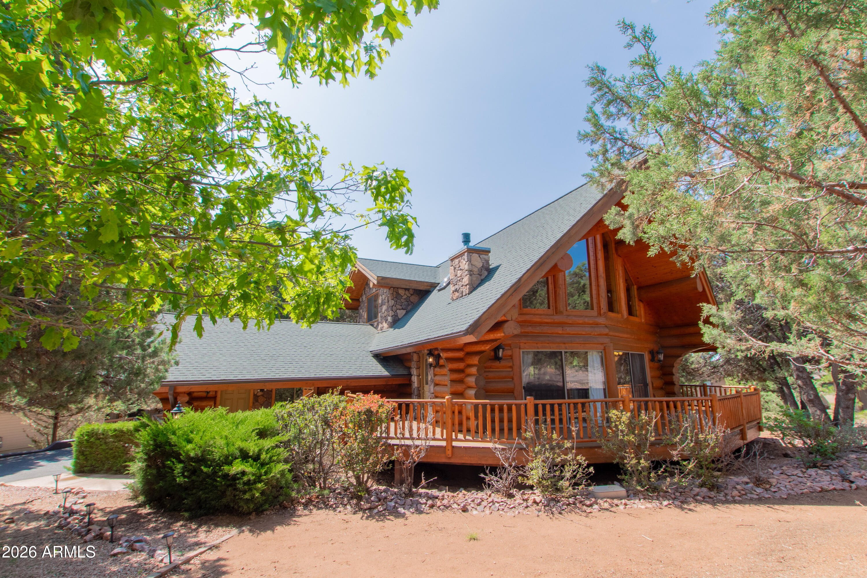 xperience mountain living at its finest in this extraordinary custom real log home nestled in the heart of Pine! Step inside and be captivated by soaring 18'' log beams and exquisite craftsmanship that blend rustic charm with timeless elegance. This inviting retreat boasts 3 spacious bedrooms, 2 bathrooms, and a generous 2-car garage, offering plenty of room for family and friends. Wake up to tranquil mornings surrounded by trees, and unwind on your expansive wooden deck as you watch local wildlife wander by or gaze at a sky full of stars. Whether you're looking for a peaceful weekend escape or a full-time sanctuary, this one-of-a-kind property is your ticket to mountain paradise. Opportunities like this are rare--don't miss your chance to own a true Pine treasure!