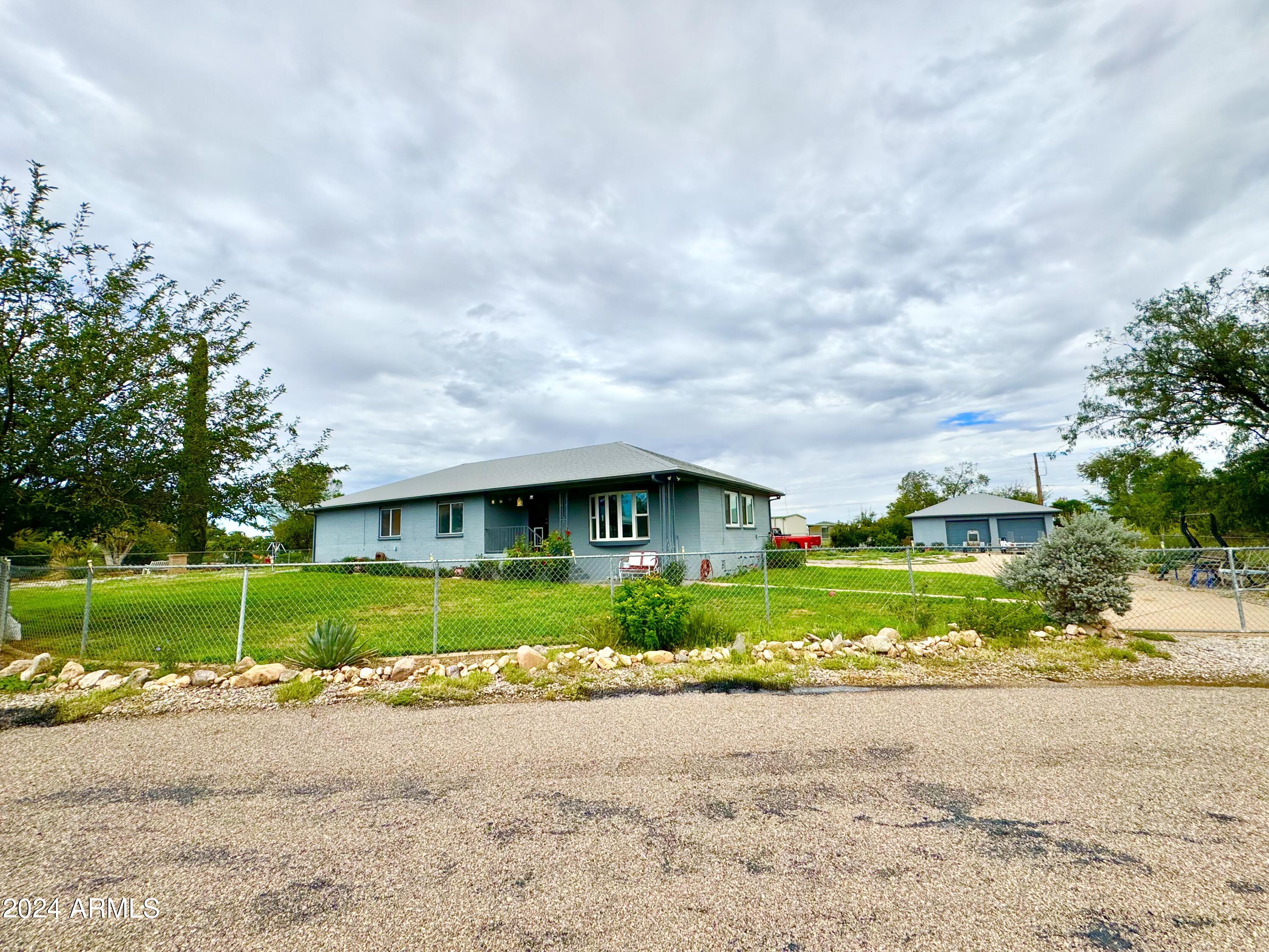 Don't miss this gem of the neighborhood! 3 bedrooms 2 bathrooms and very well maintained! Bay window; Ceiling fans; Dining room; Dual sinks/master; Family room; Hall Bathtub. Perfect for the mechanic, plumber, contractor, handyman with 2 car detached garage/workshop and an additional aprox 1750 square foot workshop with a 2 post lift and dual 9' high doors.  Newer refrigerator, washer and dryer stay. irrigation system too.
