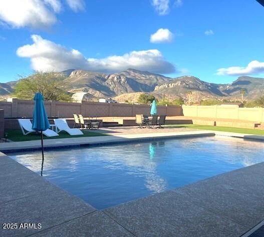 Looking for Great Unobstructed Mountain Views AND a Salt Water POOL with NO HOA?? This is the home for you! Conveniently located on a corner lot on 1.35 acres with 2 driveway entrances and a 30 Amp RV Hookup. The backyard is an entertaining paradise! Check out the list of Upgrades and Bonus Features that include an office that may be converted into a 4th bedroom, beautiful vinyl plank flooring throughout (NO CARPET!), ceiling fans in all bedrooms, newly upgraded bathrooms, tankless water heater, new heat pump, new paint inside and out, basketball half-court, 2-car garage with opener, utility shed AND MORE!