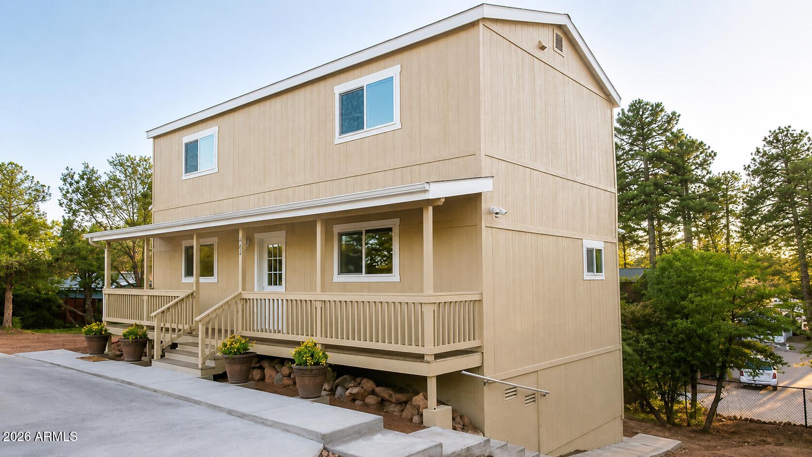 this beautiful yet affordable home right in the center of town. Quiet yet close to everything.    4 BR / 3.5 BA.(2 Master BR's). Custom paint and cabinets. Upgraded GE slate appliances. Trex decking. Energy efficient. 
Walkout basement has 1BR a 1BA and is a separate guest quarters.(rental making good money) Paved parking and RV hookup and Storage. Main home is also currently rented with month to month tenants. Create your own split floor plan home with room for everyone or own your investment property here in the cool Payson area. Here are a few ''extras'' we want to make sure you know about:
New upper roof (all except the little piece over the front porch) - fall, 2025
Fully fenced, very large side yard 
5-year water filter for ice maker & water dispenser in fridge. SEE MORE REMARKS! Cold storage under house
Parking for up to 6 cars (cement parking for 4 of them)
These things remain with the house:
Free-standing center island

Lower unit includes:
Two-door 10 cu ft fridge
Microwave
Toaster oven
Full-size sink with disposal
Flip-up counter top extension
Dimmered under-cabinet lighting
Large pantry with bright, even lighting 
Range hood with ducted exhaust fan
Induction cooktop can be put away in pantry or used on the patio with an ext cord
Ceiling fans in bedroom and kitchen/living room
43" smart TV
Flip-up coffee table
Kitchen/livingroom has hard flooring, bedroom has new carpet.
Unit is bermed up (half under ground) and so needs less heating/cooling
Window a/c and in-wall heaters 
Full-sized bathroom with roomy shower and built-in linen closet
North-facing pavers patio with pavers, table, chairs, umbrella, and 3-string patio lights, is shrubbery - secluded.