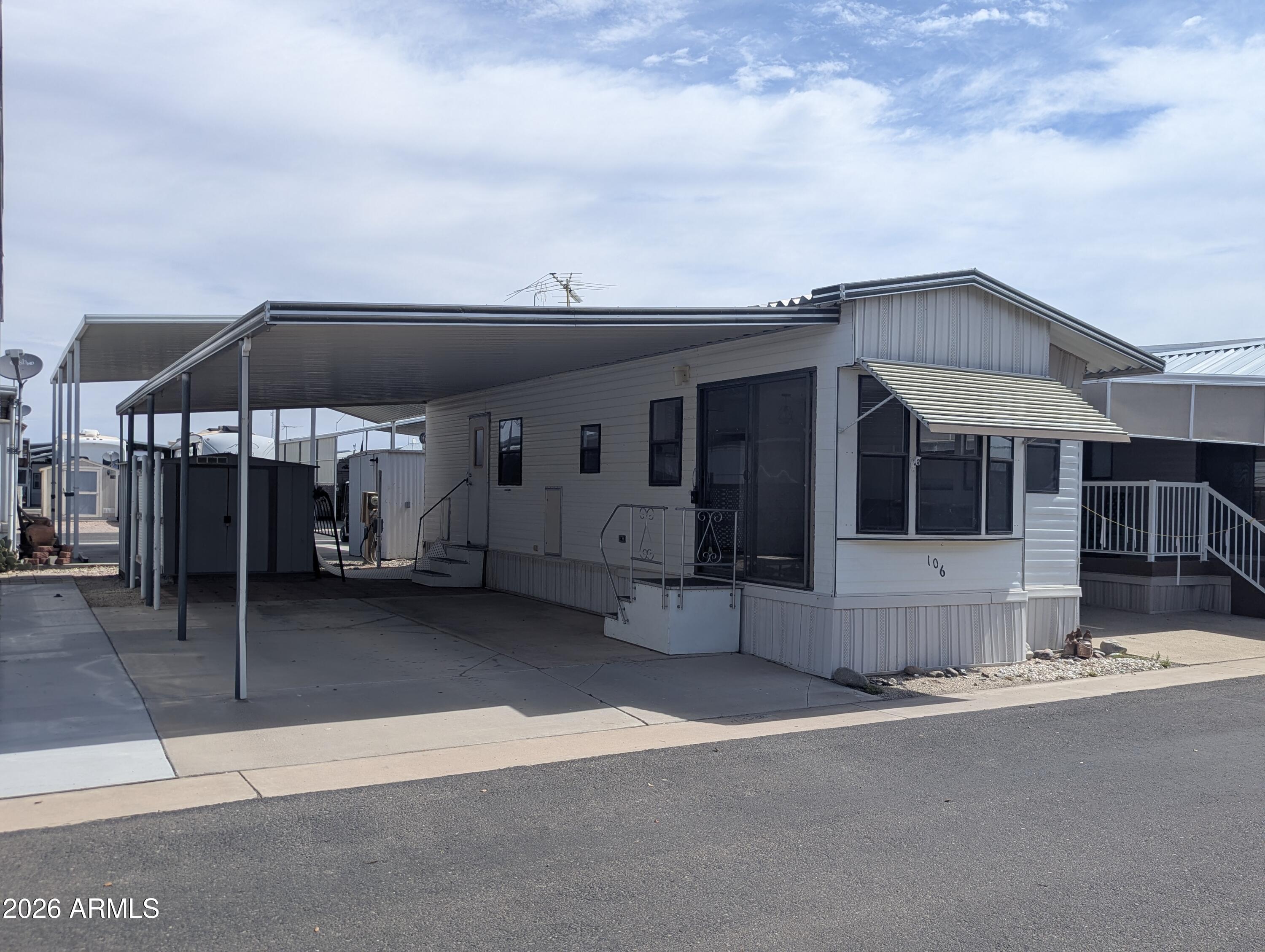 Welcome to Caliente Casa Del Sol, a sought-after 55+ community in Florence, AZ where you own the land--no land lease! This beautifully remodeled home, updated by a licensed general contractor, is move-in ready and features granite countertops, new flooring, fresh interior paint, updated lighting, new vanities, and a remodeled walk-in shower. The spacious kitchen offers a full-size range and ample cabinet space. Enjoy low-maintenance living with low HOA fees and access to community pools, clubhouse activities, and a vibrant social calendar. Perfect as a year-round residence or winter retreat. Affordable, updated, and ready for its new owner!