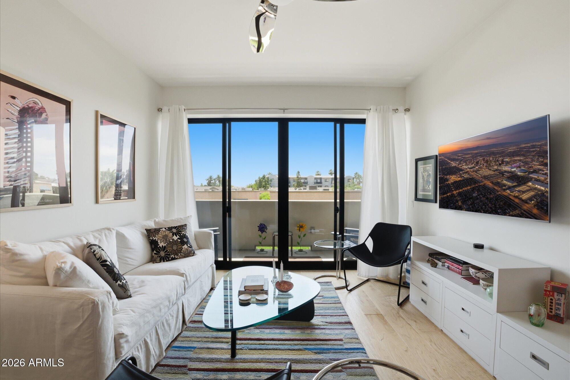 Experience a Blend of Location, Lifestyle & Luxury in this Exceptional Luxury Condominium Residence ideally located near the prestigious Biltmore Fashion Park corridor ... Designed for Sophisticated Urban Living in a Secure Community offering Camera-Monitoring and Gated Indoor Parking w/EV charger, the Residence is positioned across from Owner Lounge, Pool, & Fitness Center planned for Social Gatherings perfect for relaxing & entertaining ... Inside, Beautifully Appointed 2 Bedroom + Office/Den, 2.5 Bath Residence, Modern Comfort is combined with Flexible Living Spaces ideal for Today's Lifestyle needs - Full Time, Seasonal Lock & Leave Residency, Remote Work, or Executive Living ...  Enjoy a ''Walkable Lifestyle'' with Premier Dining, Upscale Shopping, Coffee Houses, Entertainment and Everyday Conveniences most within a 10-15 minute walk ... Nearby destinations include Trader Joe's, Whole Foods Market, Luxury Retail, Golf, Hiking, and convenient access to Sky Harbor Airport, Downtown Phoenix, Scottsdale, & Camelback Business Corridor ... Whether enjoying a Casual Walk, quick Uber Ride, or Vibrant Night Out this location delivers the Ultimate Balance of Accessibility and Luxury Living ... a Refined Low-Maintenance Lifestyle awaits you in one of Phoenix's most desirable destinations. (Furnishings, including those from Design Within Reach, may be available under separate agreement, offering a potential Turnkey Opportunity.)