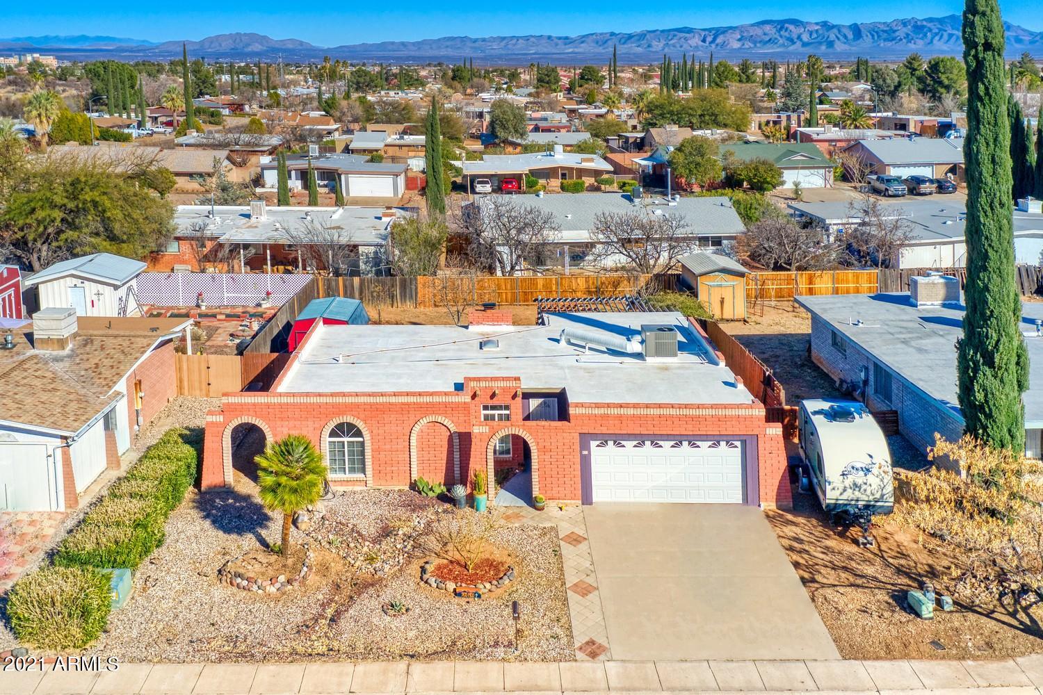 Here's your opportunity to own this lovely southwestern style home that offers 3 bedrooms plus an additional sunny and bright space currently used as a gym/office, 2 baths, 2 car garage.  Open concept kitchen-dining-living space with 2 skylights and a wood burning FP, enjoy the cozy patio and the large backyard that has a good size storage shed.  The home is well maintained by the owner and has a  brand new microwave, newer appliances and 16 SEER HVAC system that was installed 4 months ago.  Privately located on a Cul-de-Sac and close to schools, shopping, hospital and Ft Huachuca.  Check it out at your earliest convenience.