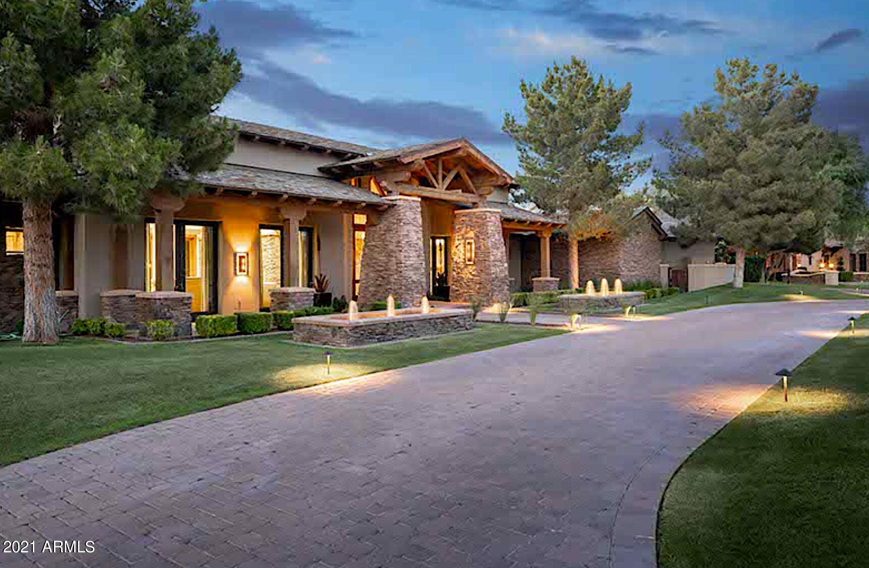Like timeless work of art, this Arizona Ranch style estate was built by Legendary Homes to last, and lived in with great sense of charm and warmth. Welcome to Villaresi, a prestigious gated community off of the most prestigious street in Paradise Valley; offers intimacy, privacy and security. This iconic residence is considered a legacy investment, meant to be passed down through generations. With no details untouched, this grand scale estate is flanked with custom finishes and a scrupulous eye to detail, perched on a 1.5 acre lot with mature vegetation. Interior features include an open floor plan, a decadent primary wing with an intimate sitting room, coffee bar, dual closets, and a dedicated gym. A generous chef's kitchen with top-of-the-line appliance package, abundant storage, plus... butler's pantry opens to the family room and dining nook. A total of 5 guest suites, and two offices, makes this a destination estate for today's work from home lifestyle. A bonus guest house is fully contained with kitchen, living room and en-suite bedroom. The unique U-shape design offers breathtaking views of the resort-like backyard to enjoy year round with multiple covered patios, pool, spa. 5 Car Garage, climate controlled storage, custom theater, wine cellar, and game room with wet bar - this home has it all.