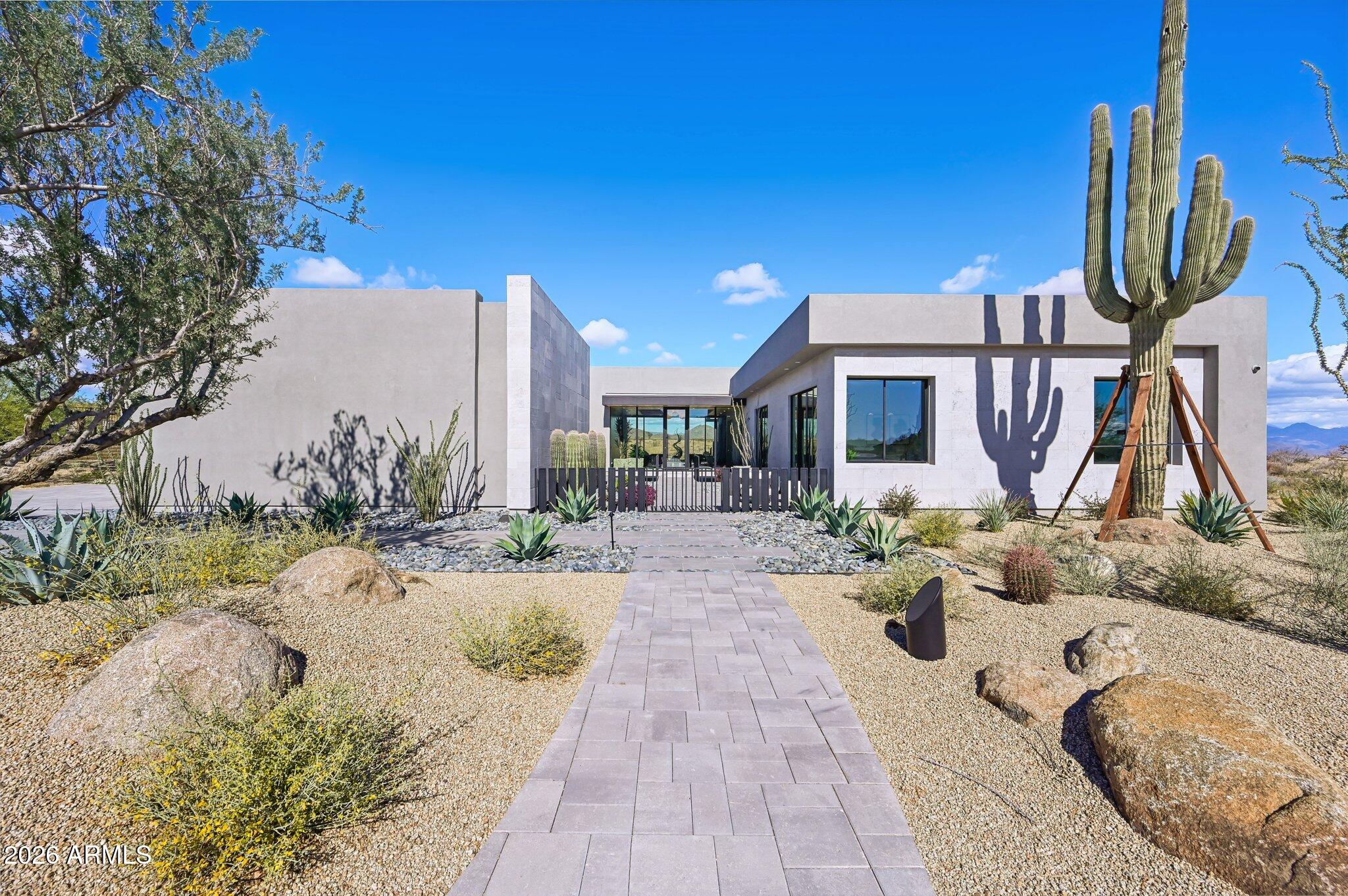 **AGENTS - Please read private remarks** 
Incredible opportunity to purchase the actual MODEL HOME at Storyrock, complete with a relaxing Resort Pool with Raised Spa and Full Landscape Package including a Cozy Courtyard with Gas Fireplace and Tongue & Groove Ceiling. Add't features include Mirlux Cabinets, Wolf & Subzero Appliances, Wood Flooring Throughout, Quartzite Countertops, Rolling Walls of Glass and Infrared Ceiling Patio Heaters. With trails offering access to the Preserve and its 150+ mile trail network, life at Storyrock includes convenient access to Tom's Thumb and endless opportunities to enjoy nature. Storyrock offers a rare opportunity to live within close proximity to the best of Scottsdale while also among Arizona's timeless natural treasures. Model available summer 2026.