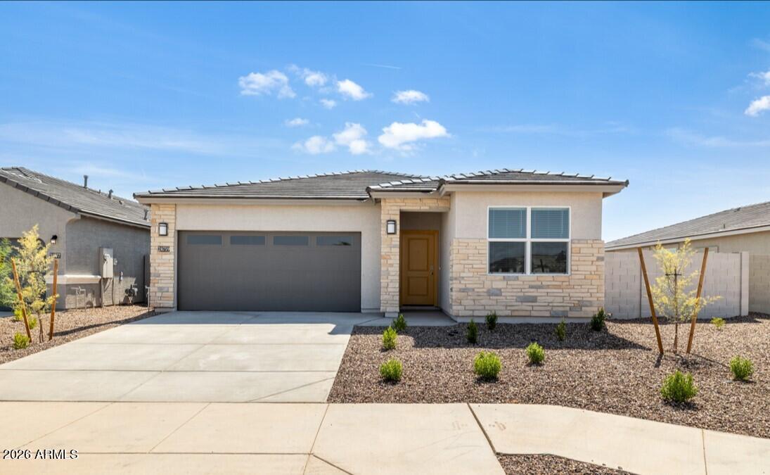 One our Most POPULAR designs!   1,703 Sq ft.  blending style and comfort. A welcoming foyer leads past secondary bedrooms into an open kitchen with island and pantry, flowing into the dining and great room. Sliding glass doors extend living space to a covered patio with backyard views. The private owner's suite features an oversized Shower and walk-in closet. With a 2-car garage, Smart Home Technology, stainless appliances, Gas Stove, Quartz counters, & Wood-Look Ceramic tile flooring. upgraded finishes, and desert landscaping, the ''Lark'' is an ideal home for gracious comfortable living.