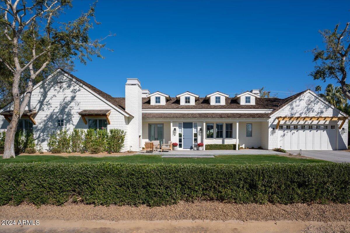 Designed by Gather Projects, this home embodies the essence of Arcadia living. Situated on a picturesque Arcadia street, its curb appeal is enhanced by a welcoming gas brick fireplace and seating area in the front courtyard. The layout is meticulously planned, featuring 4 bedrooms, 3.5 baths, and an additional flex space. Every aspect of the home, from the wide plank hardwood floors to the custom-built features, reflects thoughtful design choices. Designed for hosting, the kitchen boasts an expansive quartzite island, a butler's pantry, La Corunue range, dual dishwashers and sinks, and an additional butler's pantry. The primary suite offers spacious luxury with a stunning French door shower entry and indulgent soaking tub. Generously-sized guest rooms all feature walk-in closets, while built-in desks maximize functionality in the guest wing. The mud room and laundry room provide ample storage, ensuring every corner of the home is utilized efficiently. Camelback Mountain views grace both the living space and backyard, which is complete with a covered patio, pool featuring a Baja step, and expansive grassy areaa true sanctuary for relaxation and entertainment.