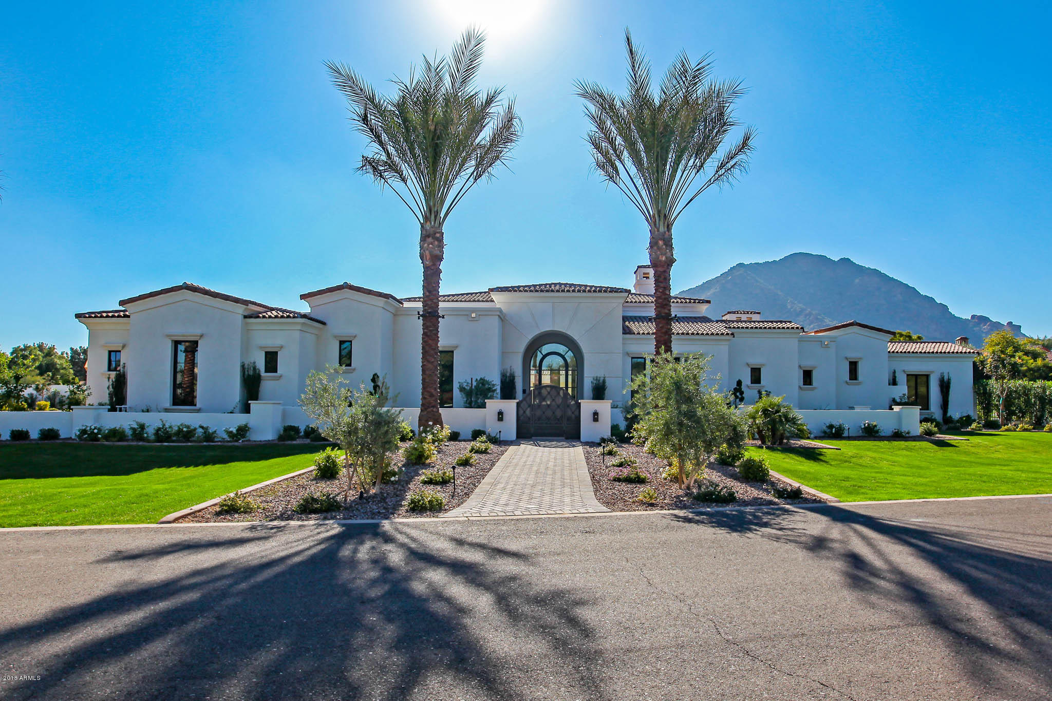 Brand NEW Chic Luxury Quality Built Home! Extraordinary Views of Camelback/Praying Munk & Mummy Mtn! Hand Finished Russian White Oak Wood Floors! Designer Restoration Hardware lighting package! Wolf 6 burner gas cooktop, Oven, Micro & built-in espresso maker! Sub-Zero fridge! Imported Marble kitchen island countertop! Butler's Pantry! Lux Gold Brizo plumbing fixtures (smart touch)! Sierra Pacific Wood Clad doors & windows! Masculine Wet Bar w/ 100 bottle Sub-Zero wine chiller! Resort backyard w/ Modern Wet Edge Pool, elevated spa, ramada w/ fireplace, outdoor kitchen & turf! Privately Gated w/ courtyard & lighted date palms! Owner's Suite features cast iron tub, custom his/her closets, exercise rm & brick pattern marble floors! Enormous guest casita w/ private garage! Shiplap wall accents