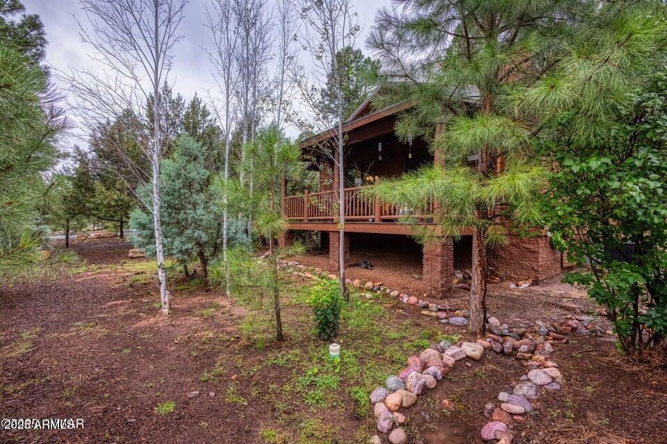Gorgeous, well kept cabin in the desirable Bison Ridge! One of the best locations in the community with a level lot, across the street from the park & community garden, nestled in the trees, and tucked away from the traffic noise of Hwy 260! This home has updated countertops, appliances, fixtures and has been recently painted inside and out. This home is a perfect blend of the rustic cabin feel with the wood burning fireplace, and vaulted tongue & groove ceilings, without compromising modern convenient upgrades. There are no restrictions on short term rentals and the furnishings are negotiable! Check out this cabin cutie!