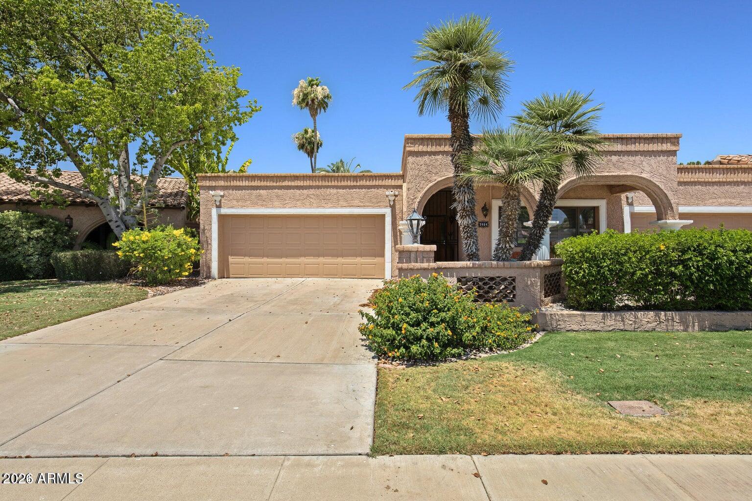 Waterfront luxury meets resort-style living in McCormick Ranch. This exceptional single-level patio home boasts direct gated access to the greenbelt and stunning, unobstructed views of the lake, Camelback, and Mummy Mountains. Relax on your private covered back patio, head a few homes down one of 2 community pools. Inside, a sunlit foyer with a skylight welcomes you into an expansive layout featuring a formal dining space and a gourmet eat-in kitchen with granite counters, stainless appliances, and a built-in wet bar with a wine cooler. The fireplace-warmed family room features beautiful wood-look tile and surround-sound speakers, while the split primary suite offers a private sanctuary with a large walk-in closet.