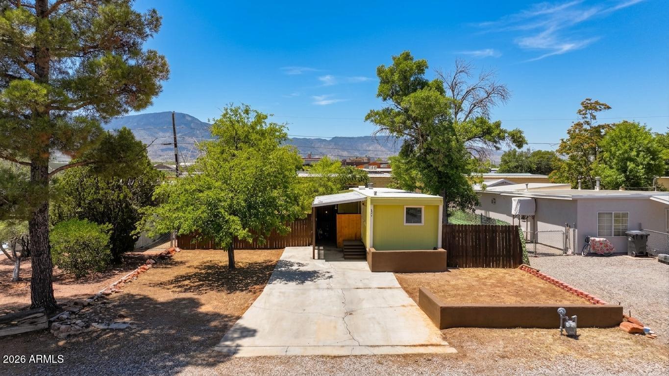 Vintage charm with investment upside in the heart of Cottonwood! This intimate 1 bedroom, 1 bathroom, 520 sq ft mobile home sits on a level 0.13 acre lot with R4 zoning, which would allow multi-family. Whether you are looking for an affordable starter home or a project with strong upside, this property gives you options. Inside, you'll find a comfortable space you can enjoy as-is, remodel to your taste, or use as a home base while you design and plan your dream home. Outside, the lot offers established trees for shade plus open areas ready for raised beds, play space, or future improvements. The flat terrain makes access and building easier. Location is a major bonus: close to the Recreation Center, Schools, Verde Valley Medical Center, Old Town, and only 20 minutes to Sedona. You'll have quick access to dining, shopping, healthcare, and a wide range of outdoor recreation, all while enjoying a residential neighborhood setting. Please note: Home does not qualify for traditional financing. Cash, private, or other non-traditional financing only. Ask about financing options.