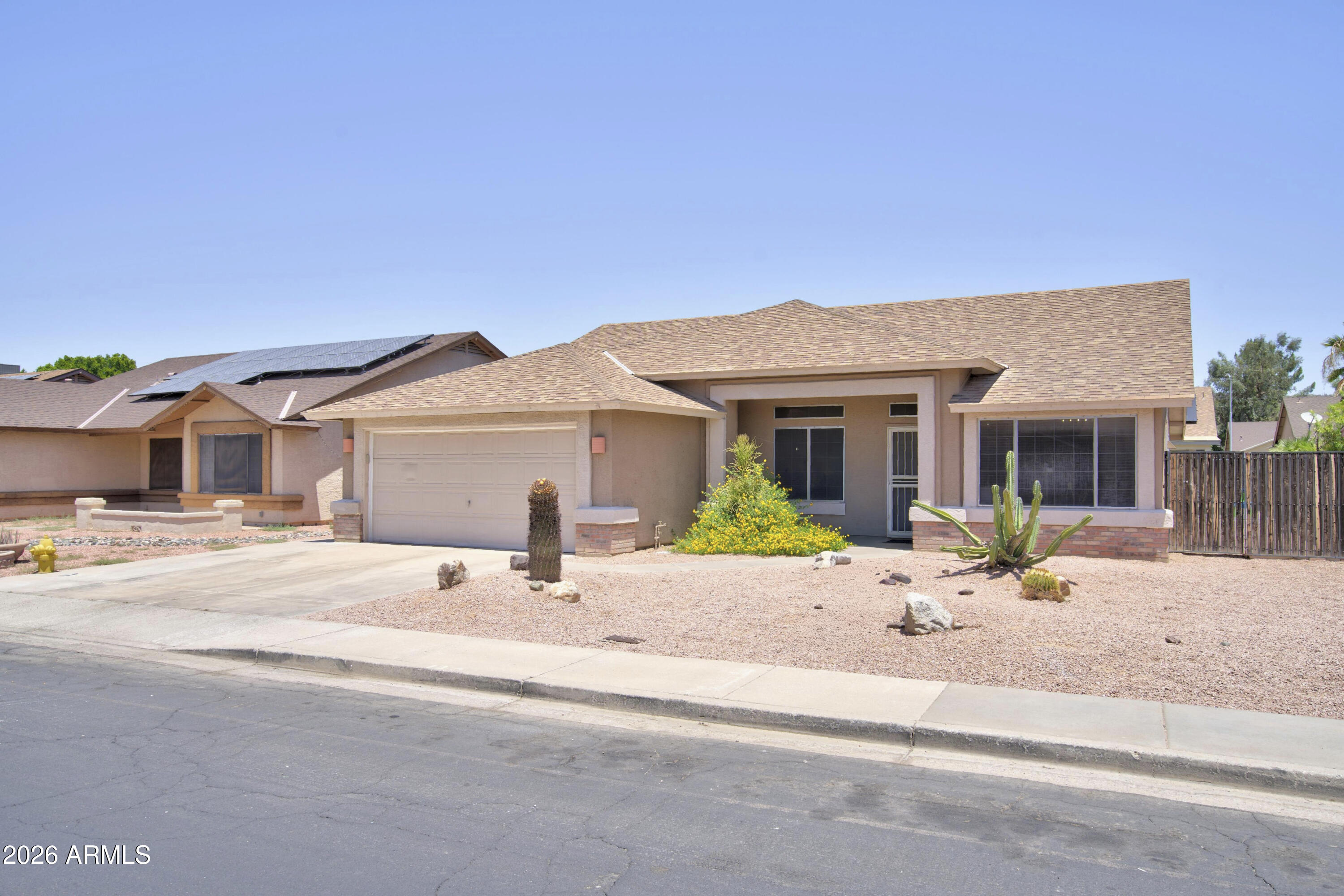 Homes like this don't come along often! Located in one of North Phoenix's most sought-after neighborhoods with NO HOA, this move-in ready home offers the lifestyle buyers are searching for. Just minutes from premier shopping, dining, major freeways, TSMC, and exciting new development, the location is hard to beat. Inside, you'll find soaring vaulted ceilings, spacious living and family rooms, a cozy fireplace, and an open-concept kitchen with a gas range and all appliances included. Recent upgrades include a NEW AC and kid friendly backyard. The oversized primary suite features a soaking tub, separate shower, and large walk-in closet. Outside, enjoy a north-facing backyard with artificial turf, an oversized covered patio, storage shed, and RV gate with additional parking.