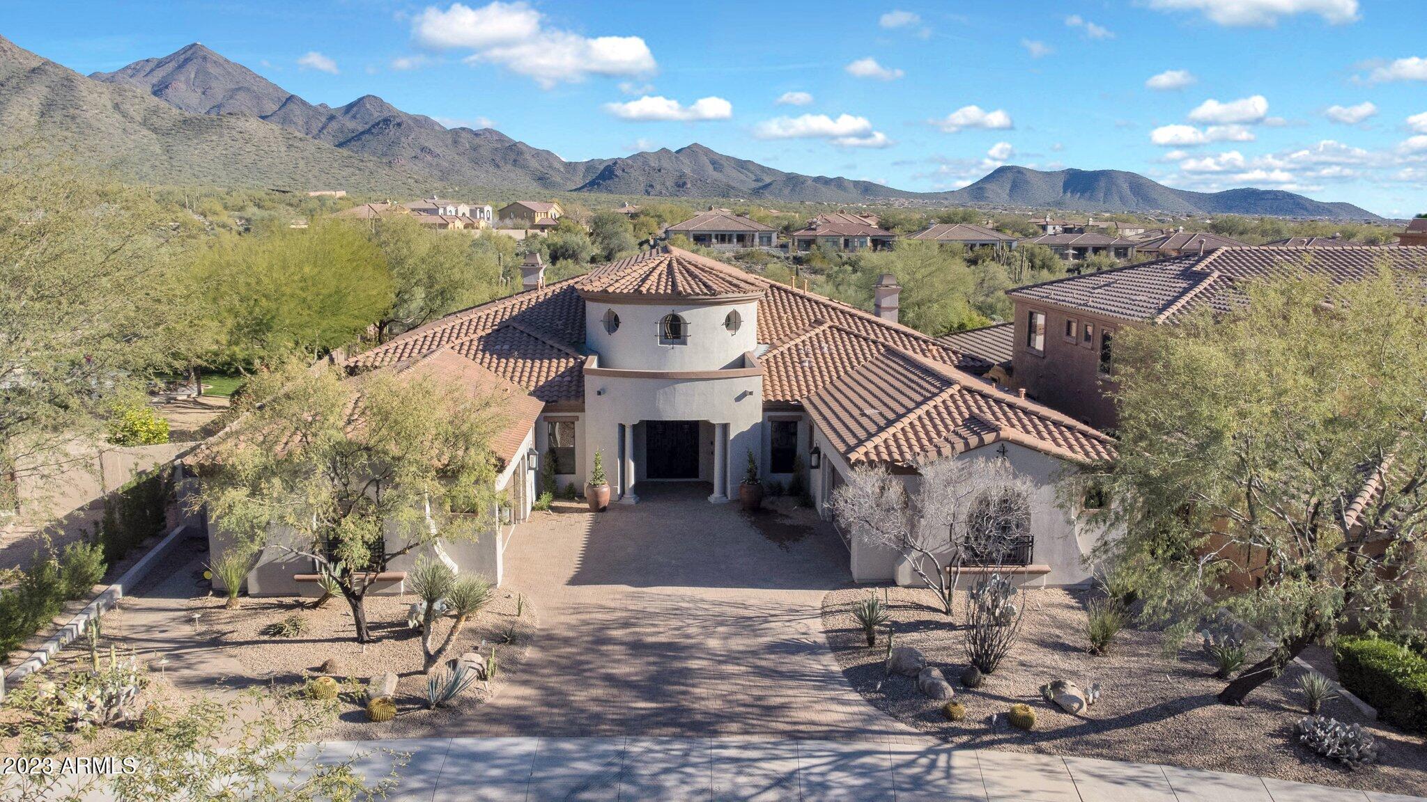 Welcome Home to Windgate Ranch! Beautifully appointed & completely remodeled in 2023! Modern transitional design w/ Restoration Hardware inspiration. White oak plank flooring, stunning 20ft fireplace/TV wall. Open kitchen layout with a huge, natural oak island, marble counters/backsplash, Wolf & Sub Zero appliances. This home boasts 4 bed/flex 5 bath +office, bonus room (for games and kids), and a beautiful family room off the kitchen. Extensive master sanctuary includes his/hers closets, sitting room, w/ RH lighting/fixtures throughout. Remaining baths are all custom designed w/ RH inspired fixtures/lighting. HUGE outdoor patio leads to a beautiful sparkling pool w/ travertine pavers, turf, fireplace, grill, HUGE mountain views WOW!