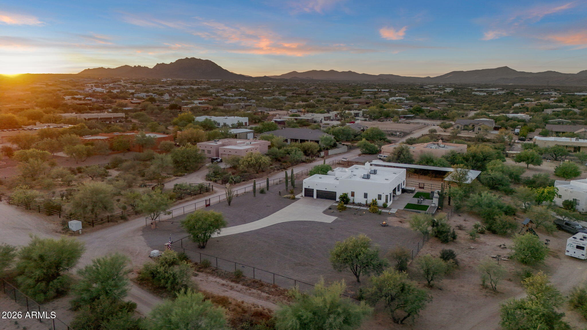 Smart, Updated Equestrian Estate on 1.25 Acres | No HOA | Mountain Views | $200k+ Upgrades

Experience the appeal of this thoughtfully upgraded North Scottsdale estate situated on a flat, fully usable 1.25-acre lot with sweeping mountain views, private electronic gated entry, and no HOA. Combining the privacy and freedom of a horse property with modern smart-home convenience, this residence offers a rare opportunity to enjoy Arizona living without compromise. Designed for both everyday comfort and lock-and-leave convenience, the property features remote-access smart locks, WiFi-enabled irrigation controls, automated landscape lighting, electronic gate access, and equestrian facilities equipped with WiFi lighting and security cameras. Whether you're a full-time resident, seasonal homeowner, or frequent traveler, you can monitor and manage key property functions from anywhere.

The home offers a desirable split-bedroom floor plan with four bedrooms and three bathrooms, including a Jack-and-Jill bath connecting two secondary bedrooms. The spacious primary suite features mountain views, a built-in electric fireplace, and a well-appointed bath. Large windows throughout the home fill the living spaces with natural light while showcasing the surrounding Sonoran Desert landscape.

Extensively improved and meticulously maintained, recent upgrades include two new HVAC systems (2022), new septic tank (2022), resealed and repainted roof (2024), fresh exterior paint and garage doors (2025), updated lighting and ceiling fans, interior/exterior paint, professionally designed landscaping, and upgraded gate controls. Additional enhancements include an outdoor entertainment area featuring a wood-burning fireplace plumbed for propane, TV, landscape lighting, paver patio, turf backyard, elevated garden beds, and a premium six-person hot tub. Design plans for a future pool and casita addition are also available.  

Equestrian enthusiasts will appreciate the newly constructed horse facilities completed in 2025, including five stalls, covered areas, lighting, electricity, turnout space, and secure perimeter fencing. The property also features a rear RV/horse trailer access gate, ample parking, and room for additional equestrian improvements, workshops, recreational vehicles, or future expansion.  

Unlike many new construction properties, this home offers the benefit of mature landscaping, established privacy trees, six mature saguaros, complete perimeter fencing, a finished three-car garage with built-in cabinetry, and extensive outdoor living improvements already in place, saving a future owner significant time and expense.  

Ideally located minutes from world-class golf, hiking, dining, and resort destinations including Troon North Golf Club, Pinnacle Peak Park, and Four Seasons Resort Scottsdale, this property delivers the perfect balance of privacy, functionality, recreation, and modern convenience.
