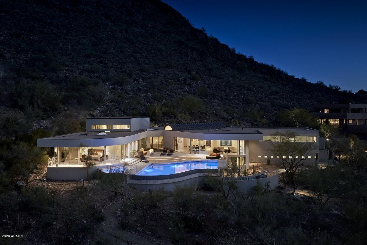 Magical views, light, tranquility and space...this home takes you a world away! Situated on northwest corner of Mummy Mountain. Lovely neighborhood and convenience close in. Windows all around highlight the beautiful mountain views. Relax in your infinity edge pool & spa while taking in the scenery.