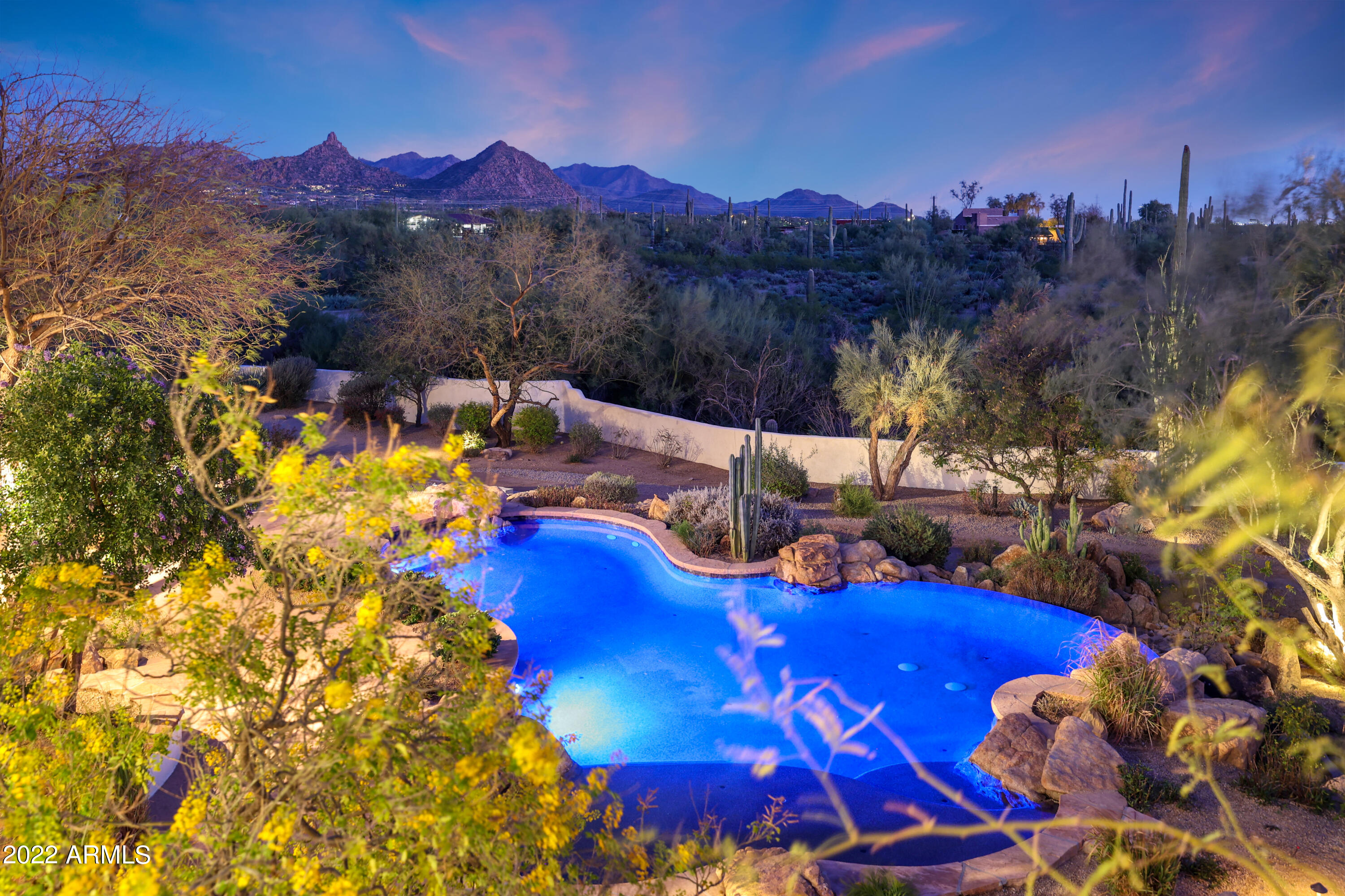Phenomenal opportunity in North Scottsdale to own your own private, field of dreams resort! This exclusive 18 acre privately owned masterpiece offers everything an estate home can possibly think of. This affluent lifestyle property was custom designed for privacy first. Then a private, gated entry with over a quarter of a mile exposed aggregate with custom lighting and tranquility on your drive to your estate with two residences, resort style pool, three tee boxes to your own custom designed golf green. This tranquil setting was created for extended entertaining and gatherings. The true to design upscale Modernized Spanish Hacienda captures the best Mountain View's, city lights and yes has its own custom baseball field. This one of a kind estate cannot be duplicated for under 10 million