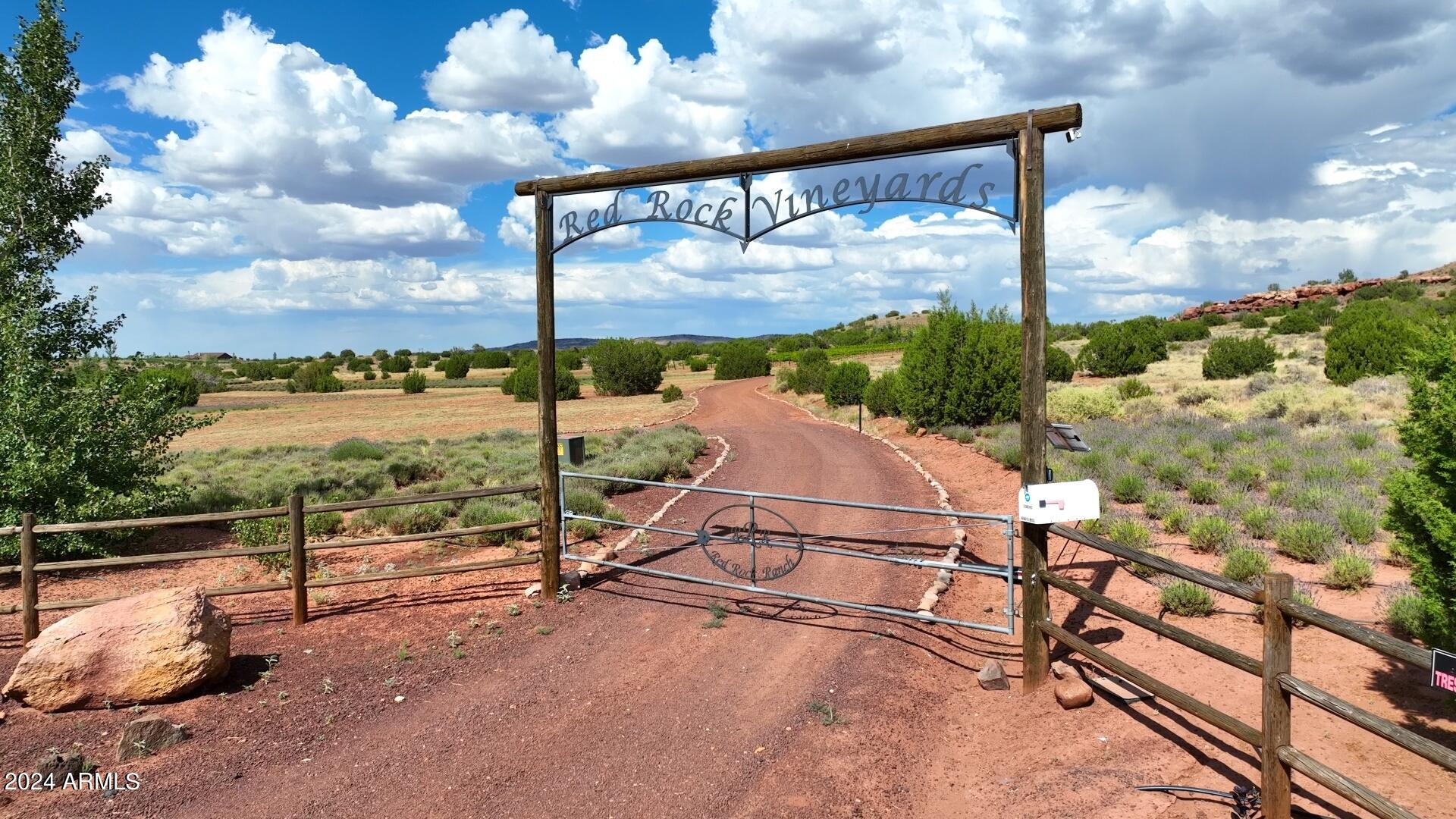 PRICED WELL BELOW THE APPRAISAL COMPLETED IN 2024, THIS ONE OF A KIND PROPERTY HAS ENDLESS POSSIBILITIES!! Combining the Red Rock Bluffs of Sedona and the Lavender Fields and Vineyards of Provence in Southern France, welcome to this established 21 year old vineyard and lavender farm at an elevation of 6,100 feet and over 120 fenced acres is up for sale for the first time! This Estate will provide you everything you could imagine and more. Cottonwoods, Red rock bluffs, stocked fish ponds with docks, water features, barns, a greenhouse and over 12,000 producing vines, 35,000 lavender plants and over 60 developed fruit trees, this lush oasis is an absolute dream away from it all. Although an active turnkey operation as it sits, the capabilities for expansion are endless! (MORE!) Online and on property, active wine and lavender sales. Four kitchens and eight barbecues on site, entertaining and serving others is abundant. All structures are built to be virtually maintenance free with the elements in mind. Each structure has its own septic system and 3 industrial built wells (grandfathered water rights) pumping over 40 GPM. Purchase as it sits to expand as you wish, or as a packaged business. The time has come for you to have your own tasting room, wine label, lavender aromatherapy brand and so much more. With the underground power, fiber optics, heating and cooling, water rights, and multiple structures built, this one of a kind compound is unmatched!