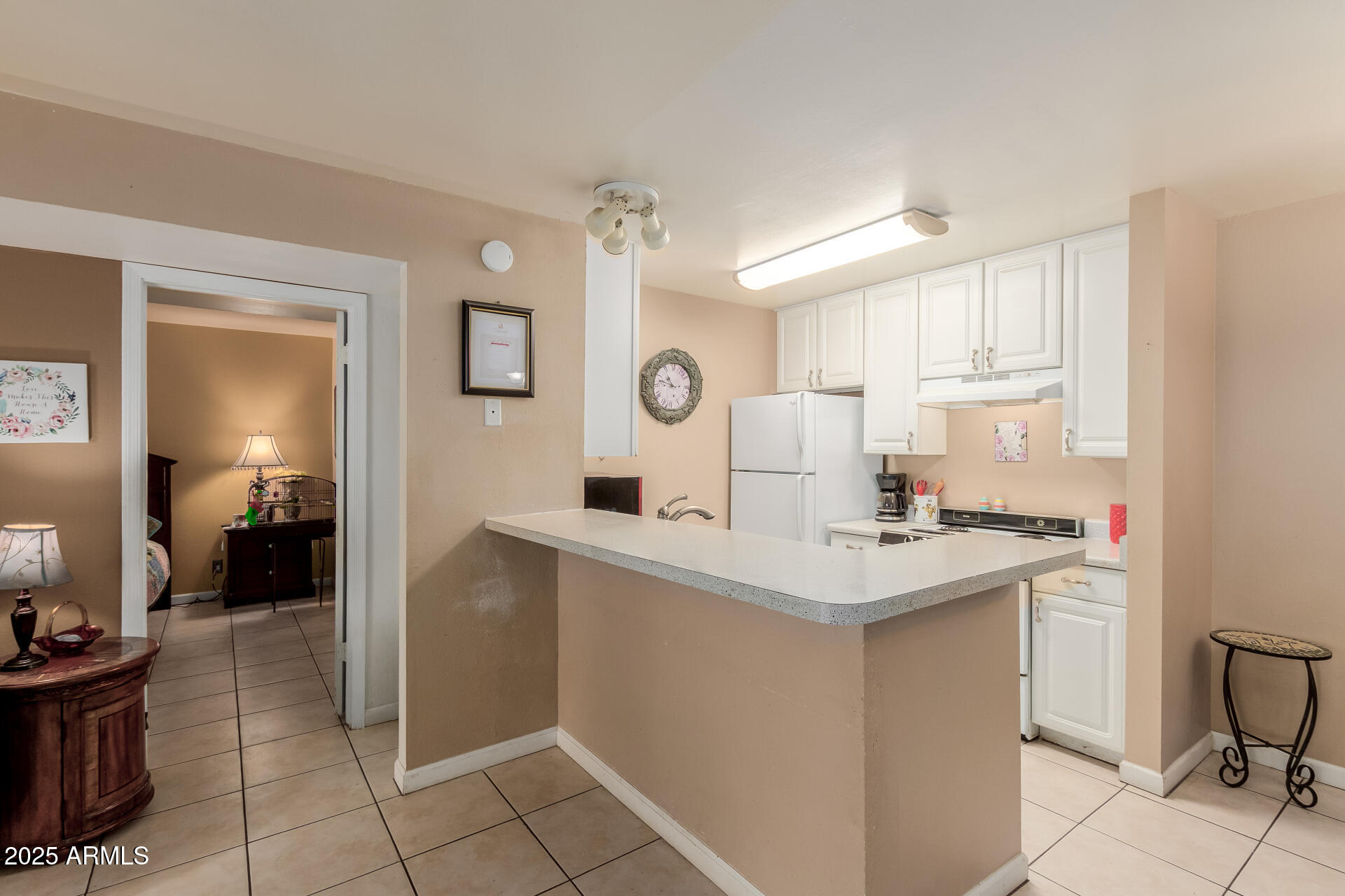 Beautiful unit within steps of clubhouse, gym, and tennis court! AFFORDABLE living in the epicenter of Scottsdale activities, shopping, and trails! Featuring a new 2025 HVAC, NEW garbage disposal, updated walk-in shower, granite vanity, tile flooring with 4'' baseboards, and one of the largest patios in the community, this 1-bed, 1-bath Scottsdale condo offers resort-style amenities including a pool, pickleball courts, and on-site laundry. Conveniently located near top shopping, dining, and entertainment venues. Ideal for professionals or as a comfortable retreat. HOA takes care of the roof and exterior.