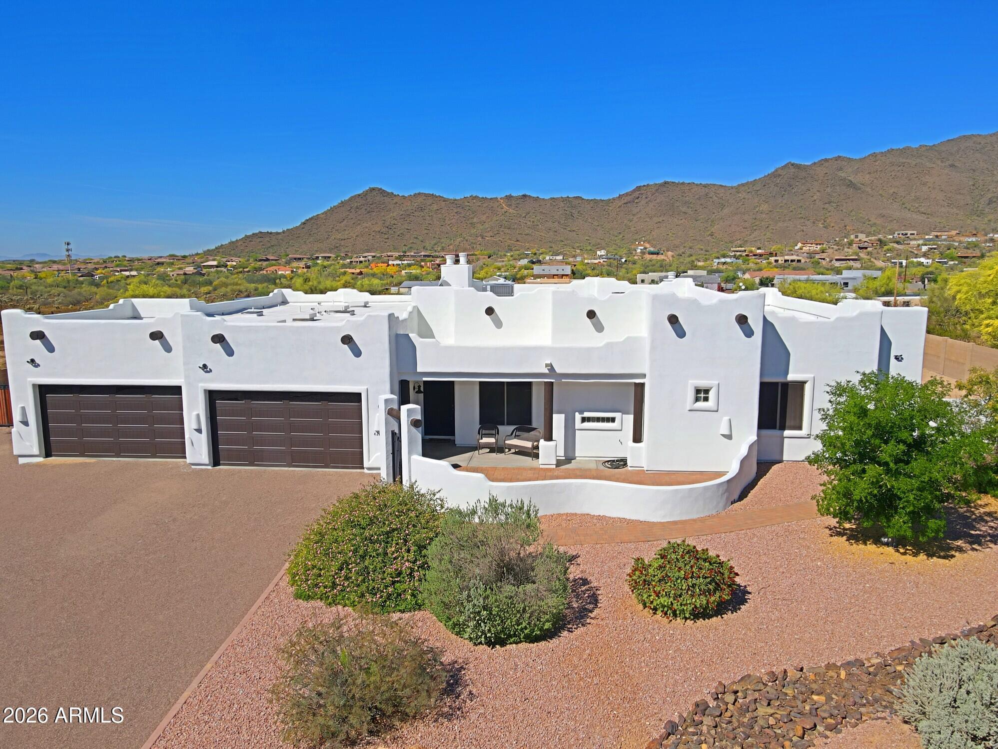 Looking for views and privacy? Custom home with no HOA, pride of ownership, move in ready. Stunning mountain views, level usable land, no flood zone, paved roads, border state land!  Split floor plan with spacious kitchen open to great, large kitchen island, 4 bedrooms, 3 baths, 4 car garage. Highly upgraded with tile flooring, hickory cabinets, granite countertops,  stainless steel appliances including fridge, gas cooktop, 3 fireplaces. Master suite with separate exit to back patio, double sinks,  jetted tub, large walk-in closet. New interior, exterior paint, master HVAC replaced 2024, roof recoated 2025, water heater 2019, new pool built in 2022. Horse set up, 4 stalls with water, round pen. Large covered patio with exterior fireplace. $10K closing cost concessions with full price offer Home warranty included. Lot coverage 25%, additional 5,000 sf can be build on this lot, RV garage, guest house, workshop