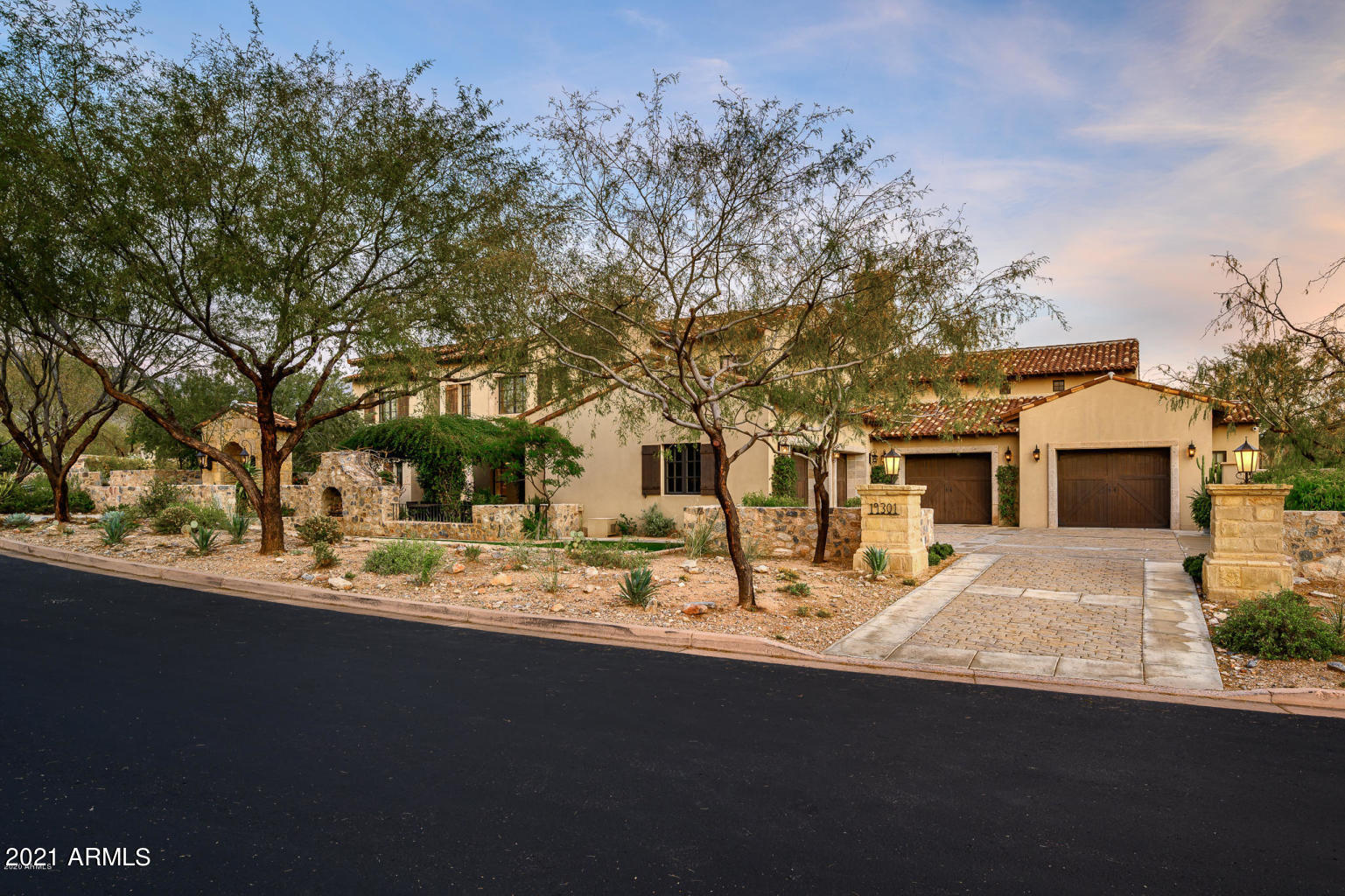 Located on Club Circle in the Horseshoe Canyon of Silverleaf, and a short walk to the Silverleaf Club, this lovely Rural Mediterranean 6-bedroom home is a family/entertaining home extraordinaire. The home is thoughtfully crafted with the highest quality of finishes chosen by Nate Burkus Design, creating a design style that is sophisticated yet casual.  Whether your family or guests want to lounge by the pool, relax in the ramada, play on the sport court or just admire the estate grounds, its the ultimate in outdoor living.  Likewise, the interior spaces are not only charming and well thought out, but offer opportunities for gathering, dining, working and playing.  The spacious exercise room is a playground for adults or children, with equipment, batting cage, rock climbing wall, steam shower and serene outdoor retreat. Not only is this home lovely and of the highest quality, but it will provide your family and friends an opportunity to live life well and to the fullest.