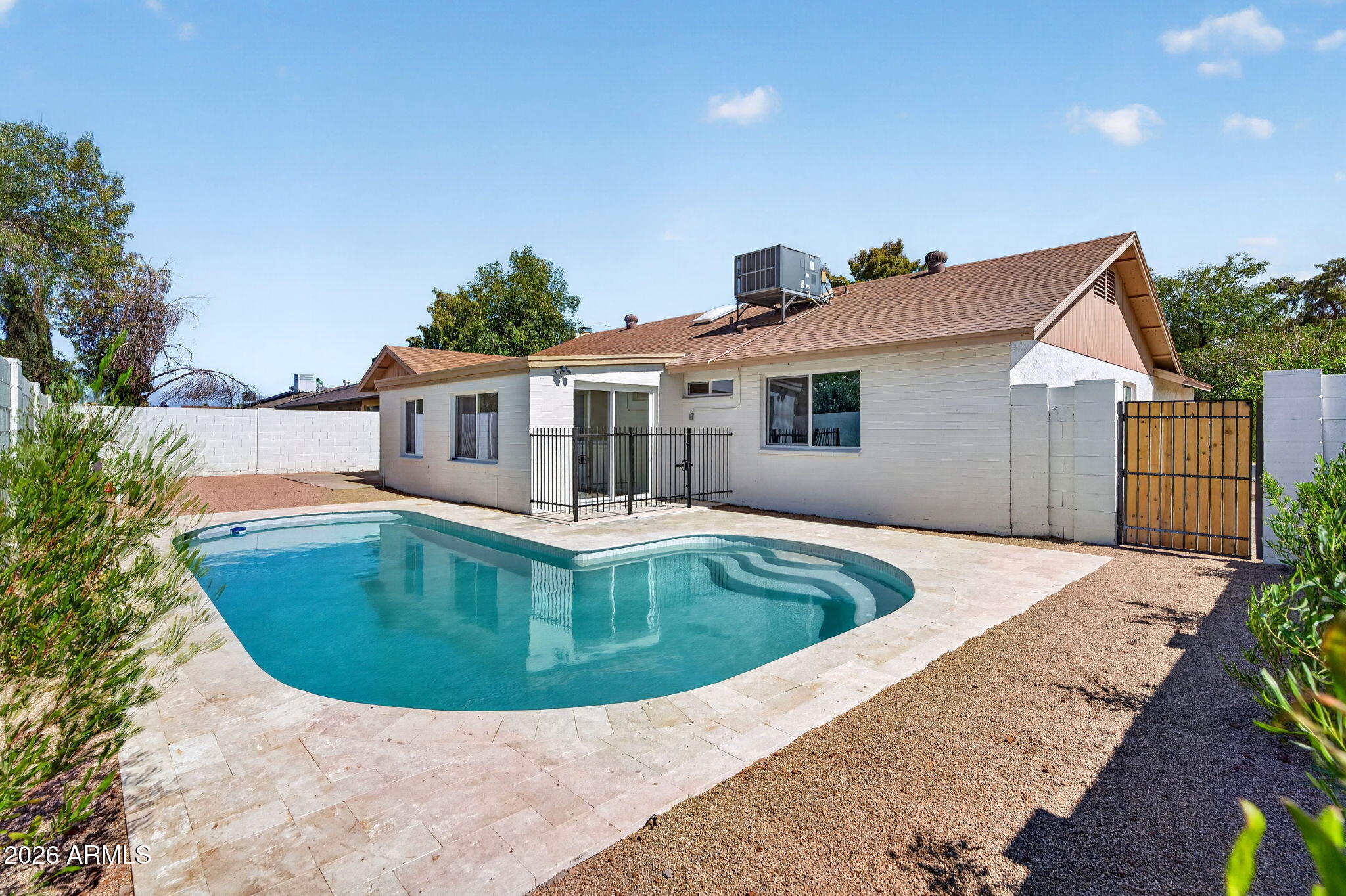 Welcome to 2104 E Enid Ave, a beautifully remodeled 4-bedroom, 2-bathroom home that perfectly blends modern design with warm, inviting finishes. From the moment you step inside, you'll appreciate the thoughtful updates throughout, creating a move-in ready space that feels both stylish and comfortable. The versatile floorplan includes a bonus room/den near the back of the home, offering the perfect space for a home office, playroom, media room, or additional living area. The completely renovated interior features contemporary touches, updated finishes, and a cohesive design that flows seamlessly from room to room. Step outside to your private backyard retreat where the pool has been fully remodeled with PebbleSheen finishes and surrounded by elegant travertine pavers, creating the perfect setting for relaxing, entertaining, and enjoying Arizona's beautiful weather. Location is everything, and this home delivers. Situated just minutes from excellent shopping, dining, and convenient access to the US-60, you'll also enjoy being less than 10 minutes from the vibrant restaurants, nightlife, and events of Downtown Gilbert. This is the perfect opportunity to own a turnkey home with modern updates, a resort-style backyard, and an unbeatable location.