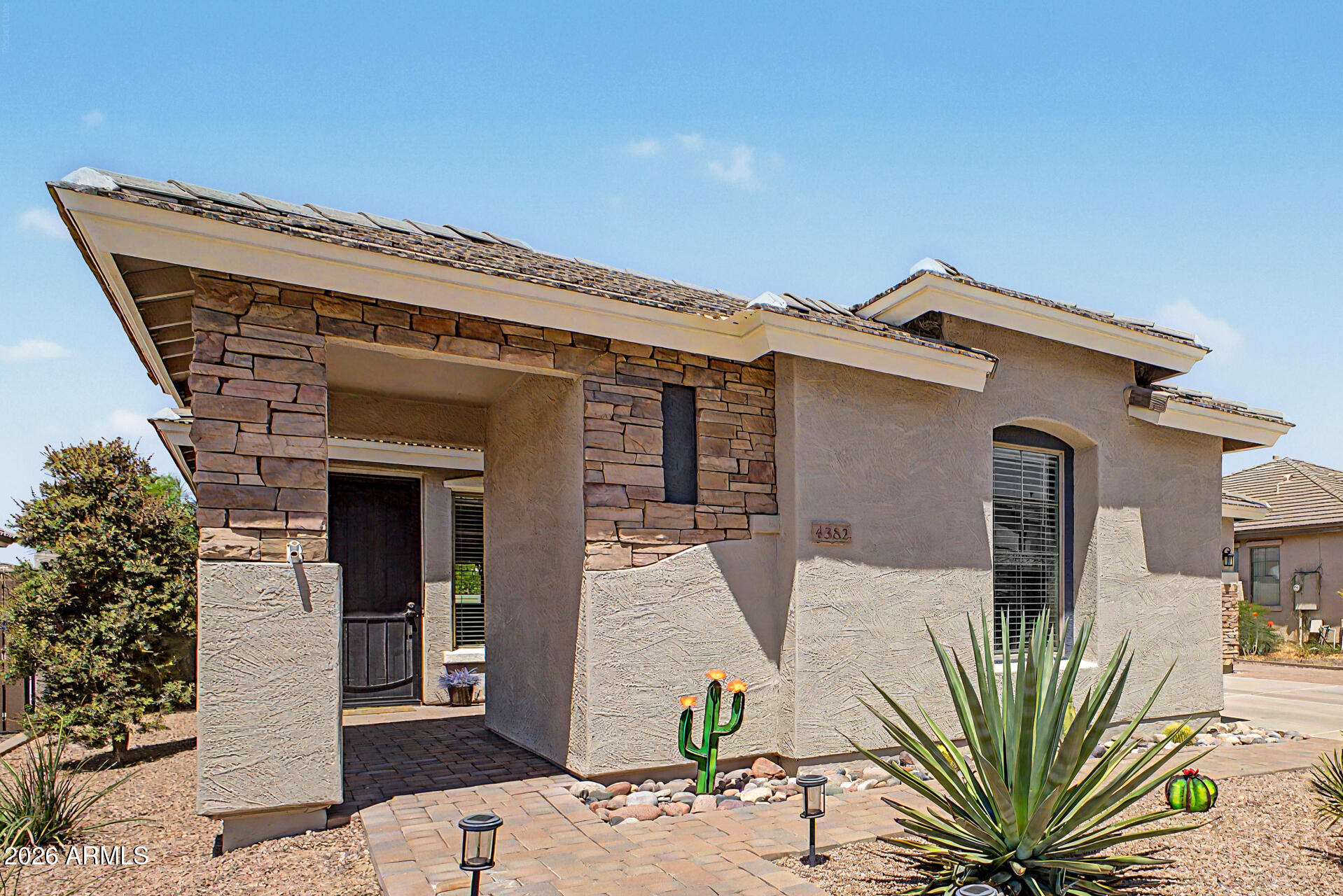 Home, sweet home! This stunning gem is located in the prestigious Seville Golf and Country Club community of Gilbert featuring an attached studio CASITA with full bathroom. Be impressed as you enter this gorgeous home, featuring a harmonious open floor plan with 3 bedrooms, office, family room, bonus work room, open formal dining, living room and designer kitchen, boasting an island with breakfast bar and a pantry. The main retreat showcases a private bathroom, with custom barn door entry, dual sinks, separate shower/tub, spacious walk-in closet and separate water closet. You'll love hosting memorable get-togethers in the private backyard oasis including a sparkling pool with waterfall, covered patio with beverage fridge, built-in BBQ, and synthetic grass lounging area. Huge side yard with massive 8ft RV gate, extending out to additional pavers expanding the drive up to the 2-car garage.
